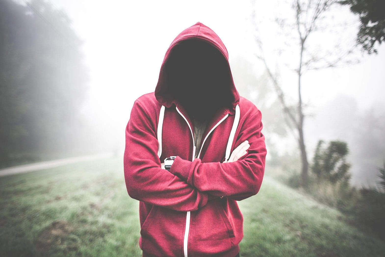 Stylish young man wearing a red hoodie Wallpaper