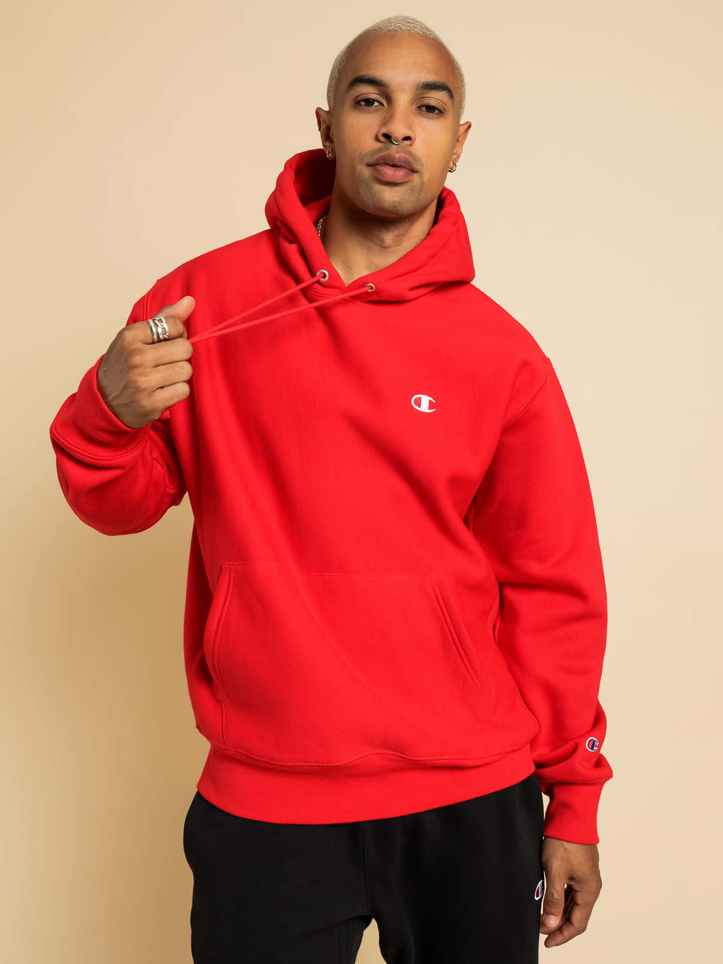 Stylish person in red hoodie against a colorful backdrop Wallpaper