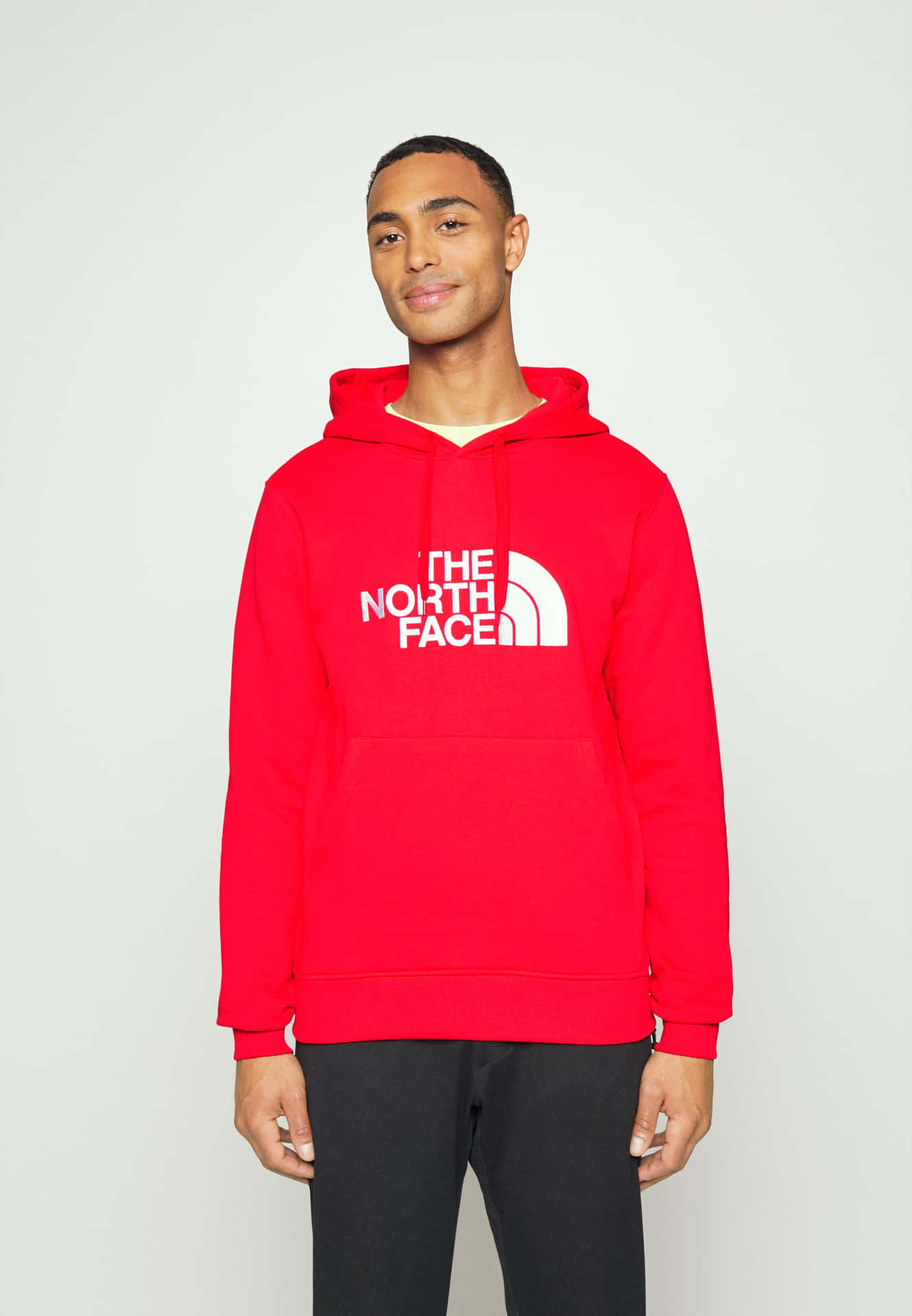Young man in stylish red hoodie sweatshirt Wallpaper