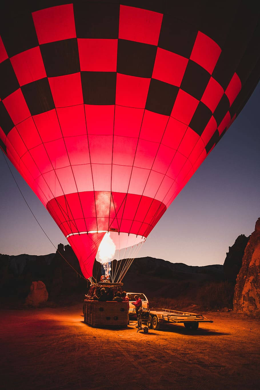 Red Hot Air Balloon On The Ground Wallpaper