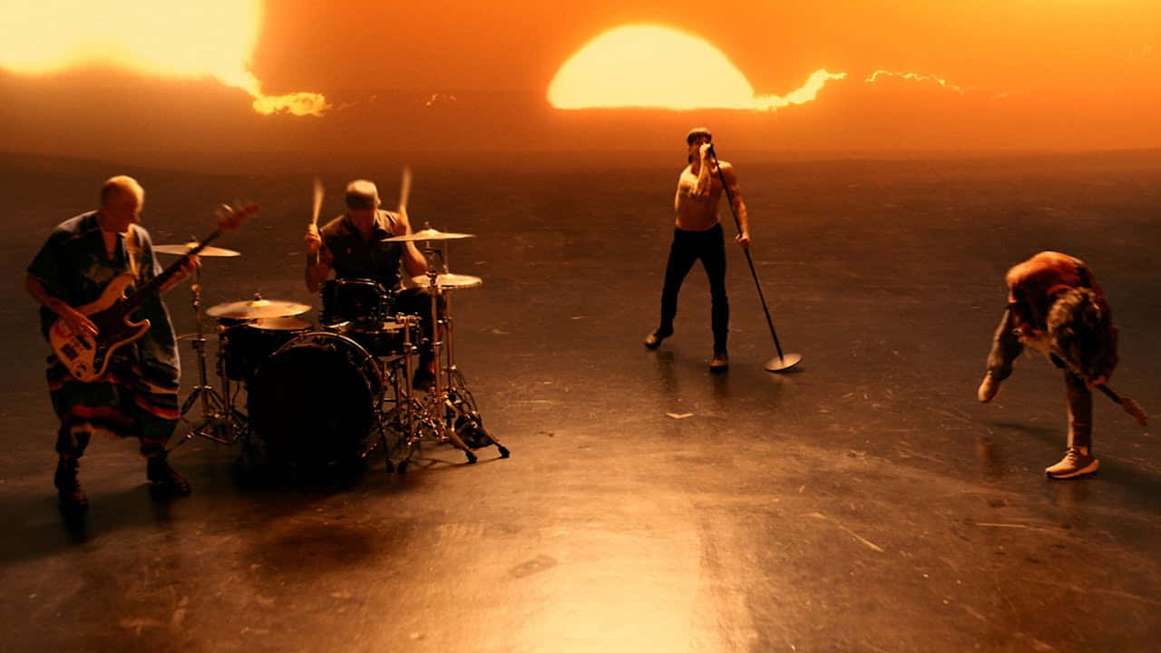 Red Hot Chili Peppers Playing Music During Sunset Wallpaper