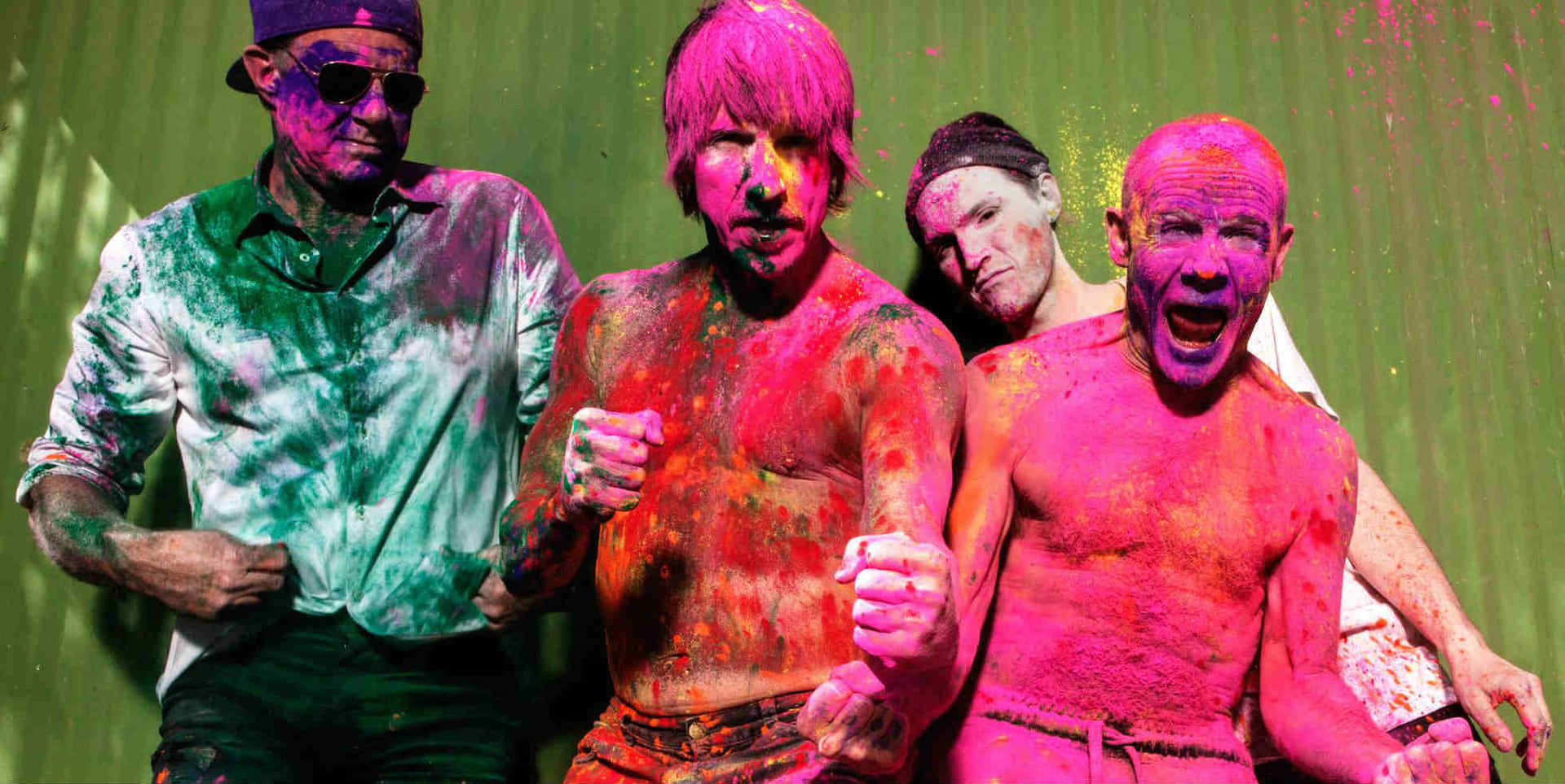 Holi Festival - A Group Of Men With Paint On Their Faces Wallpaper