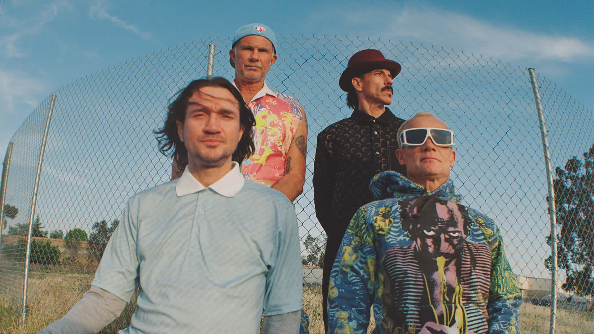 Redhot Chili Peppers Con Recinzioni Metalliche Sfondo