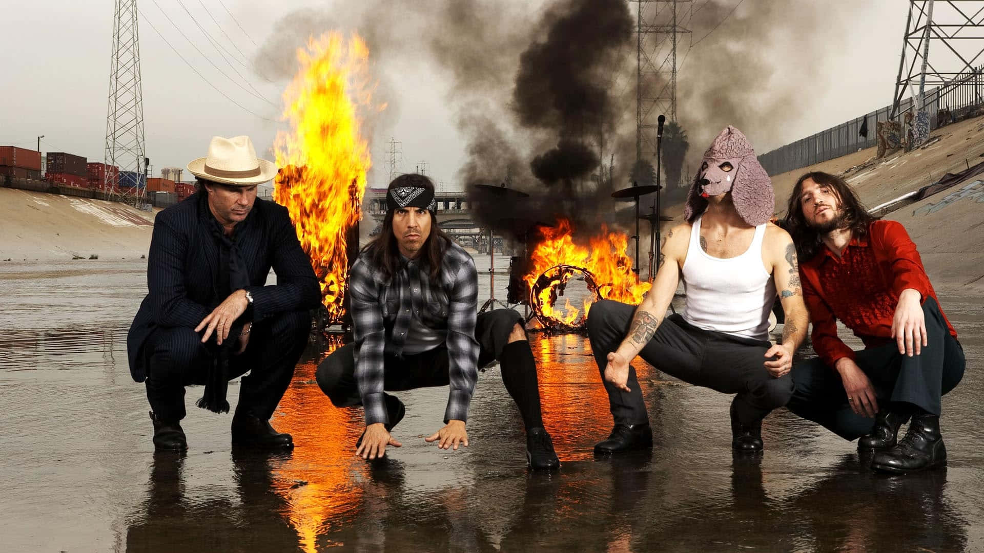 Red Hot Chili Peppers With Burning Equipment Wallpaper
