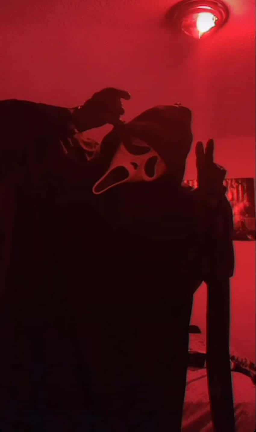 Red Hued_ Scream_ Mask_ Pose Wallpaper