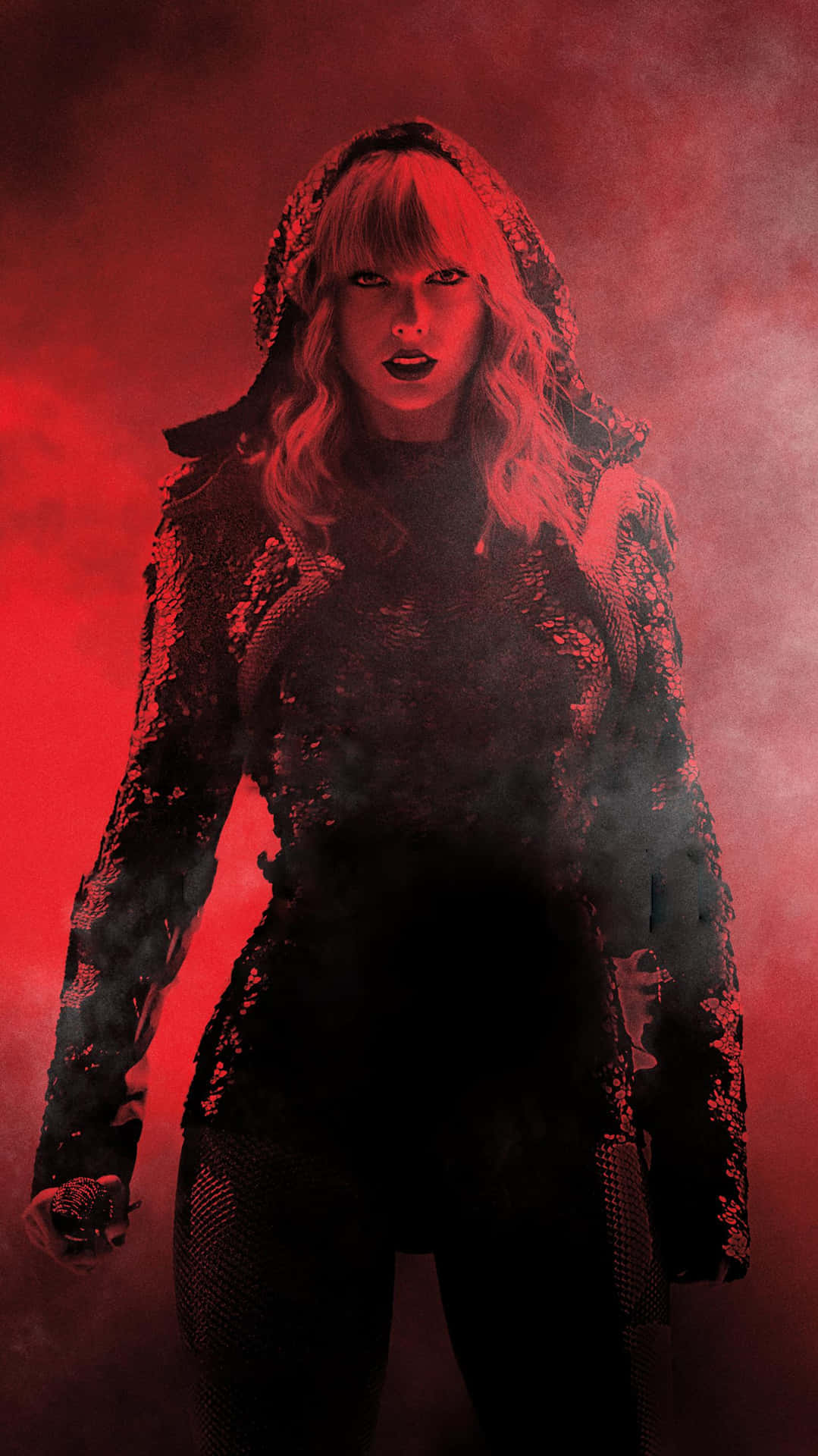 Taylor Swift In A Red Outfit Standing In Front Of A Smokey Background