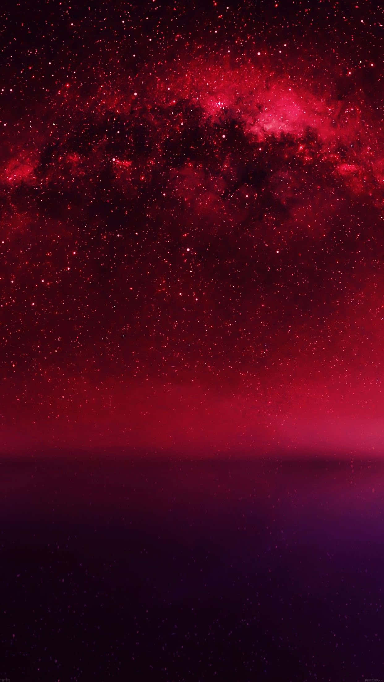 A Red And Purple Galaxy With Stars And Milky