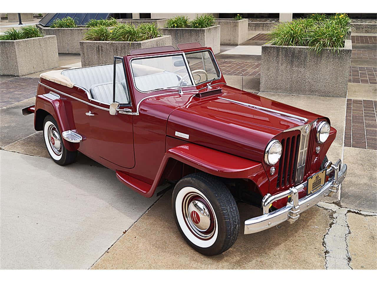 Red Jeepster Cruising In The Wilderness Wallpaper