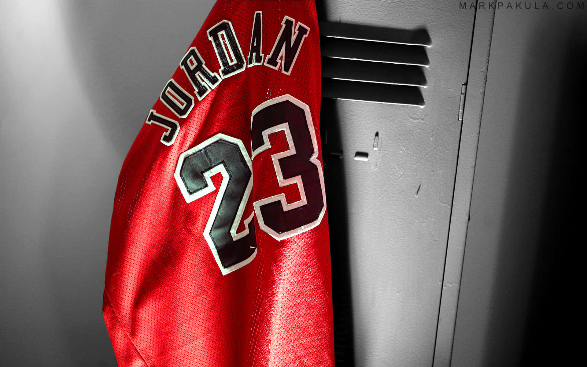 A Red Jersey Hanging On A Wall Wallpaper