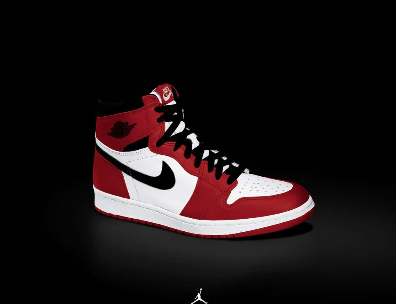 A Red And White Jordan Shoe On A Black Background Wallpaper