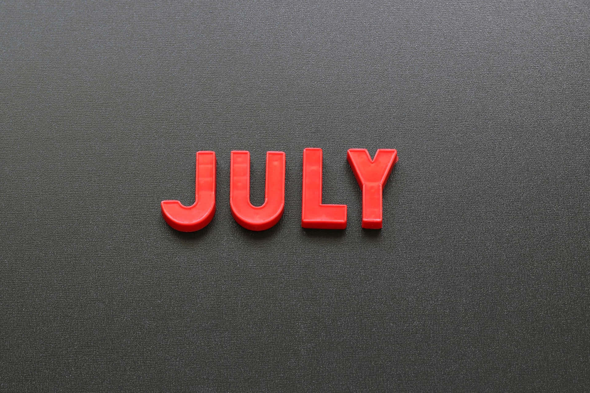 Red July Letterson Gray Background Wallpaper