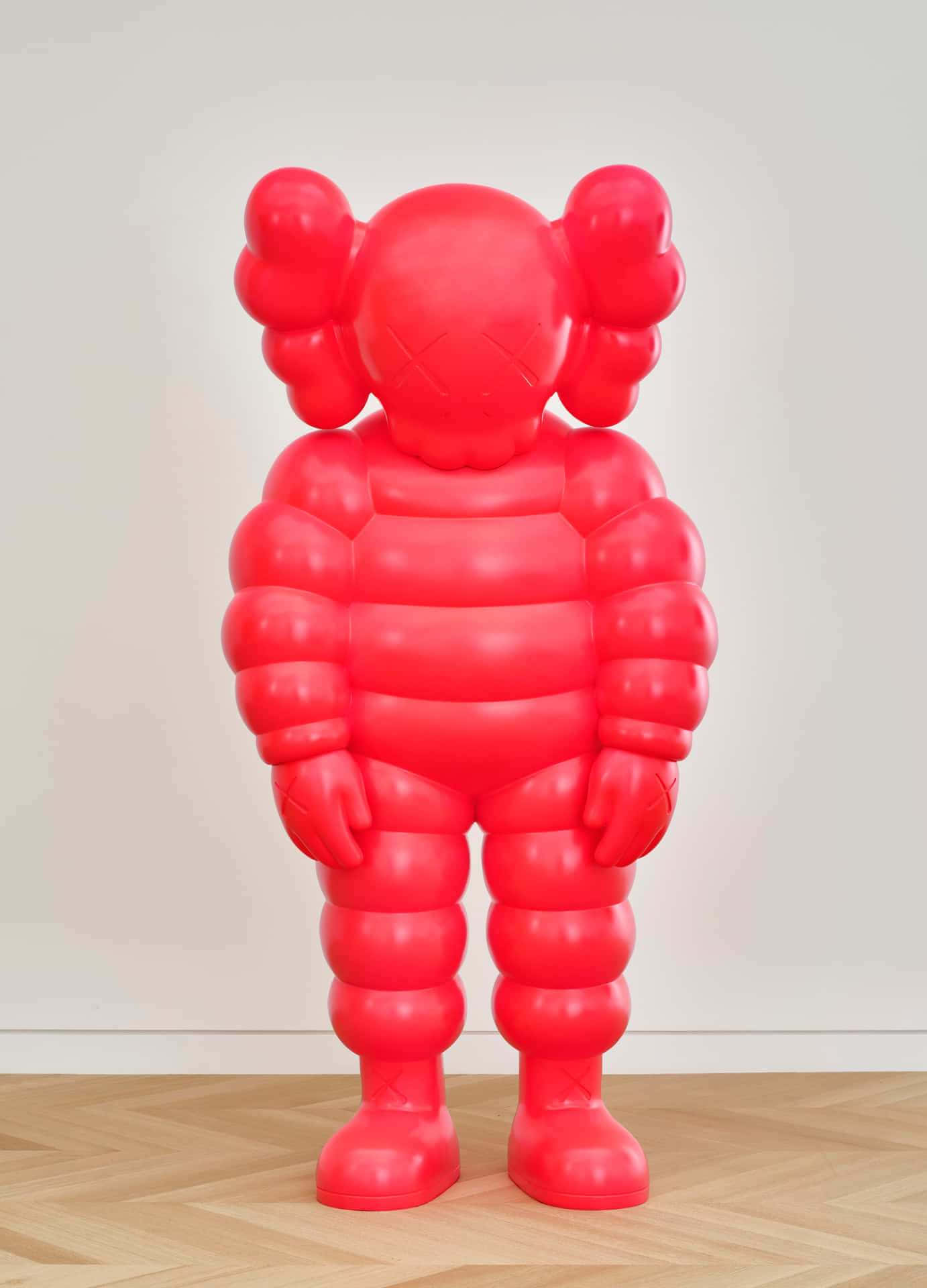 Red Kaws Balloon Figure Sculpture Wallpaper