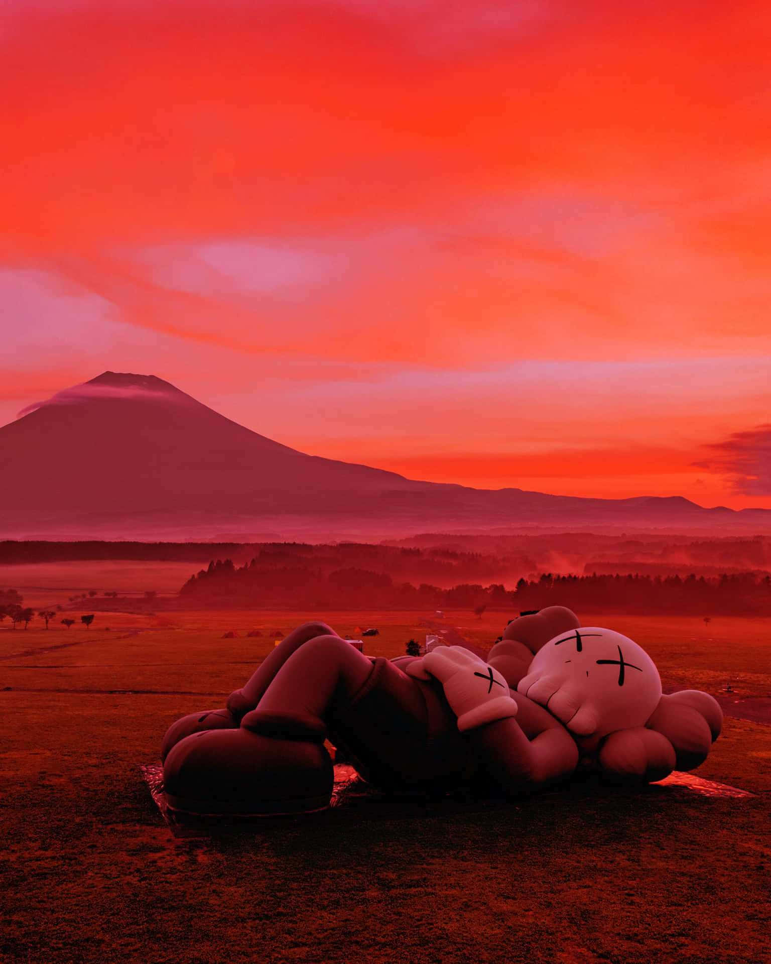 Red Kaws Sculptureat Sunsetwith Mount Fuji Background Wallpaper