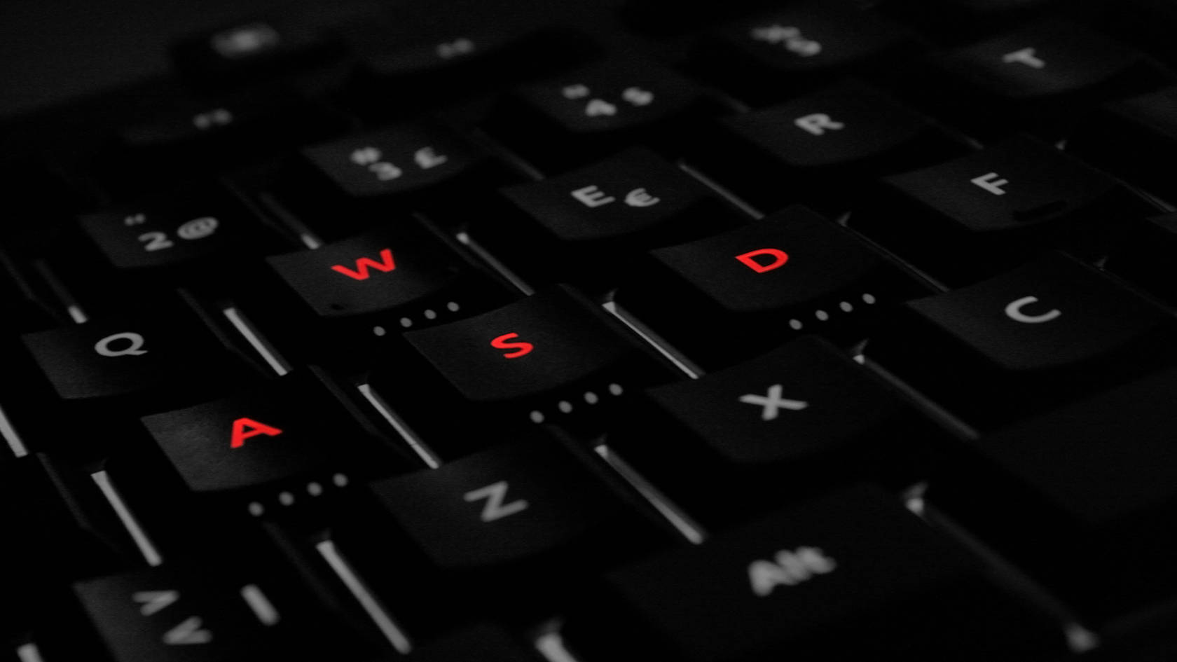 Red Labeled Gaming Laptop Wasd Keyboard Wallpaper