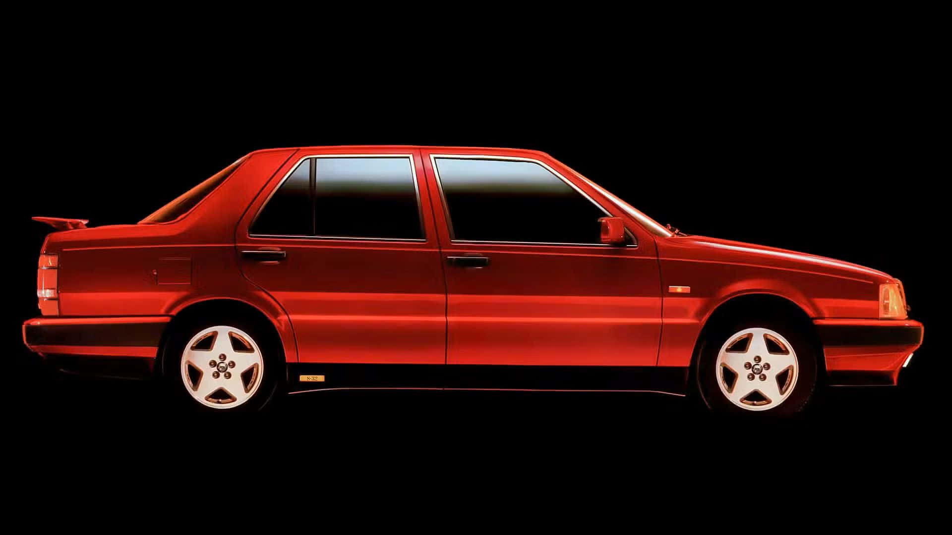 Vue Latérale De La Lancia Thema Rouge Fond d'écran