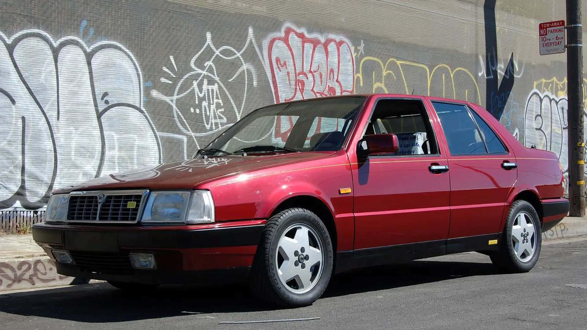 Lancia Thema Rouge En Arrière-plan Urbain Fond d'écran