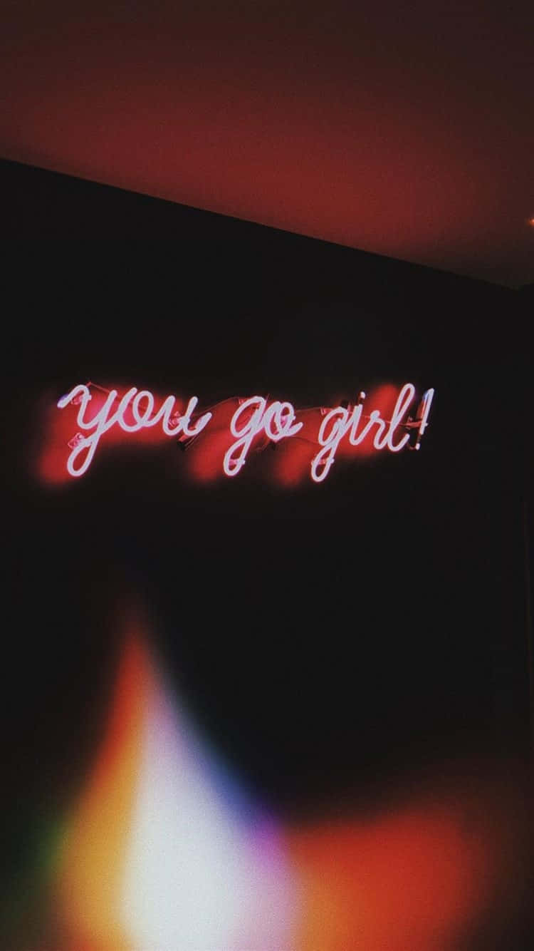 A Neon Sign That Says You Go Girl Wallpaper