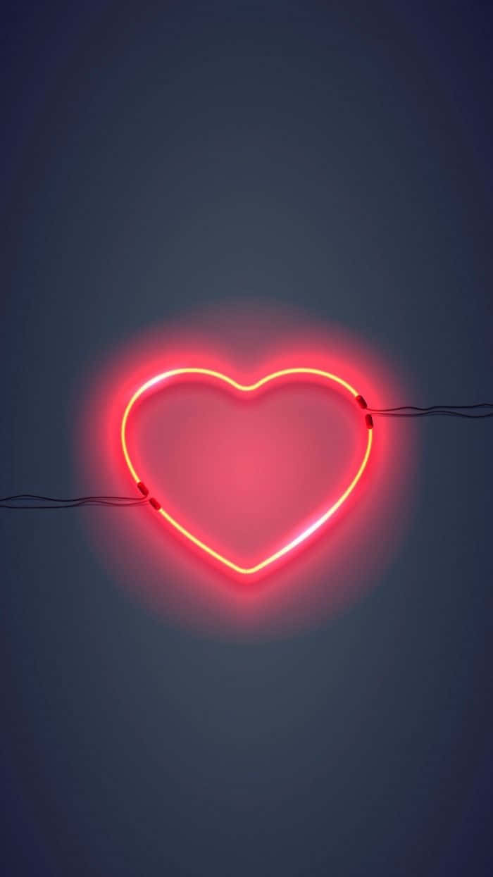 A Red Heart Neon Sign On A Dark Background Wallpaper