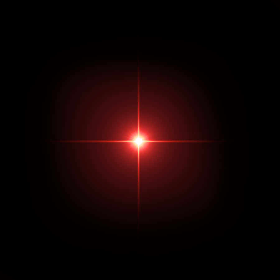 A Red Laser Light On A Black Background