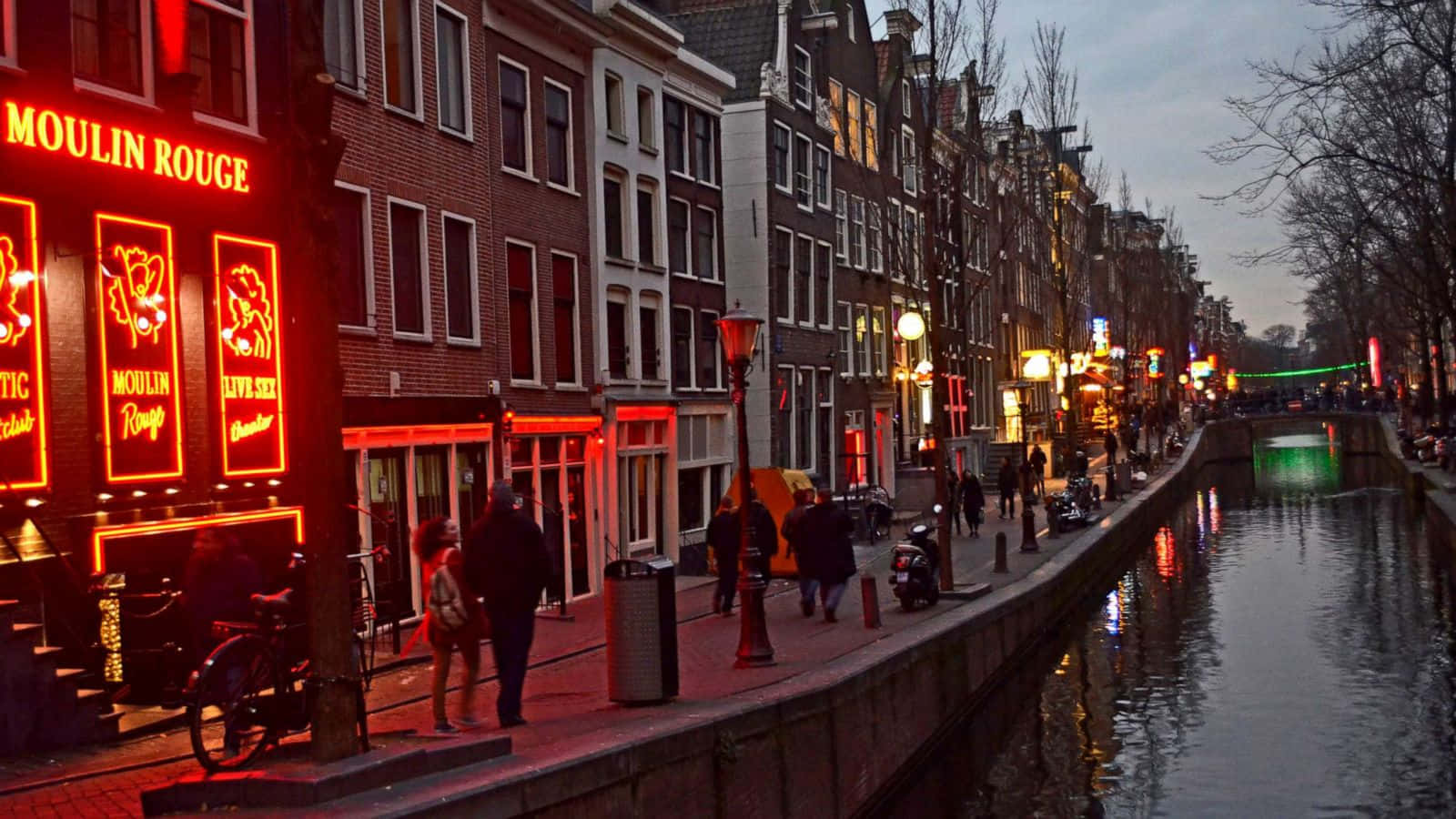 Bustling view of the Red Light District at night Wallpaper