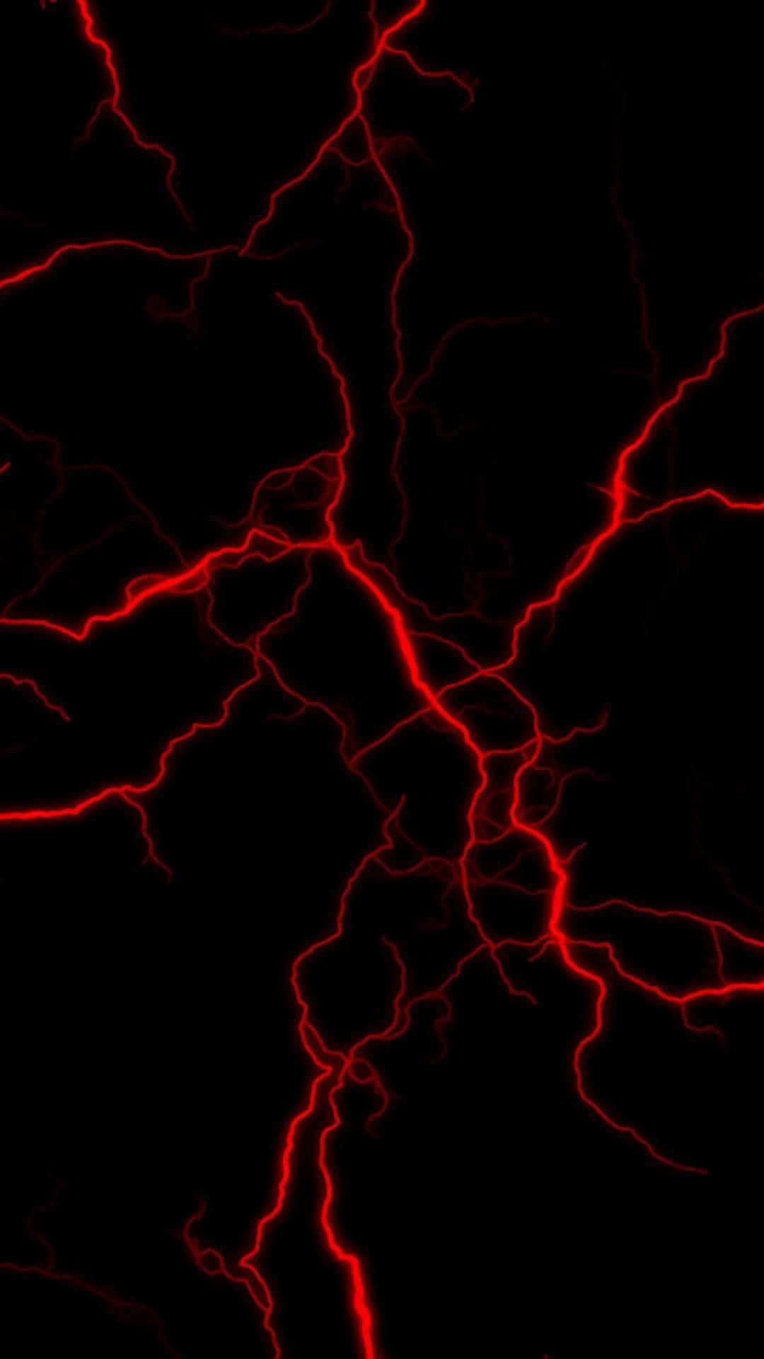 A bolt of red lightning streaks across the night sky.