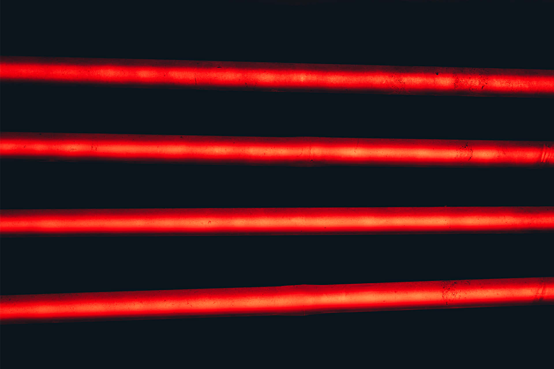 A red line cascades through the night sky Wallpaper