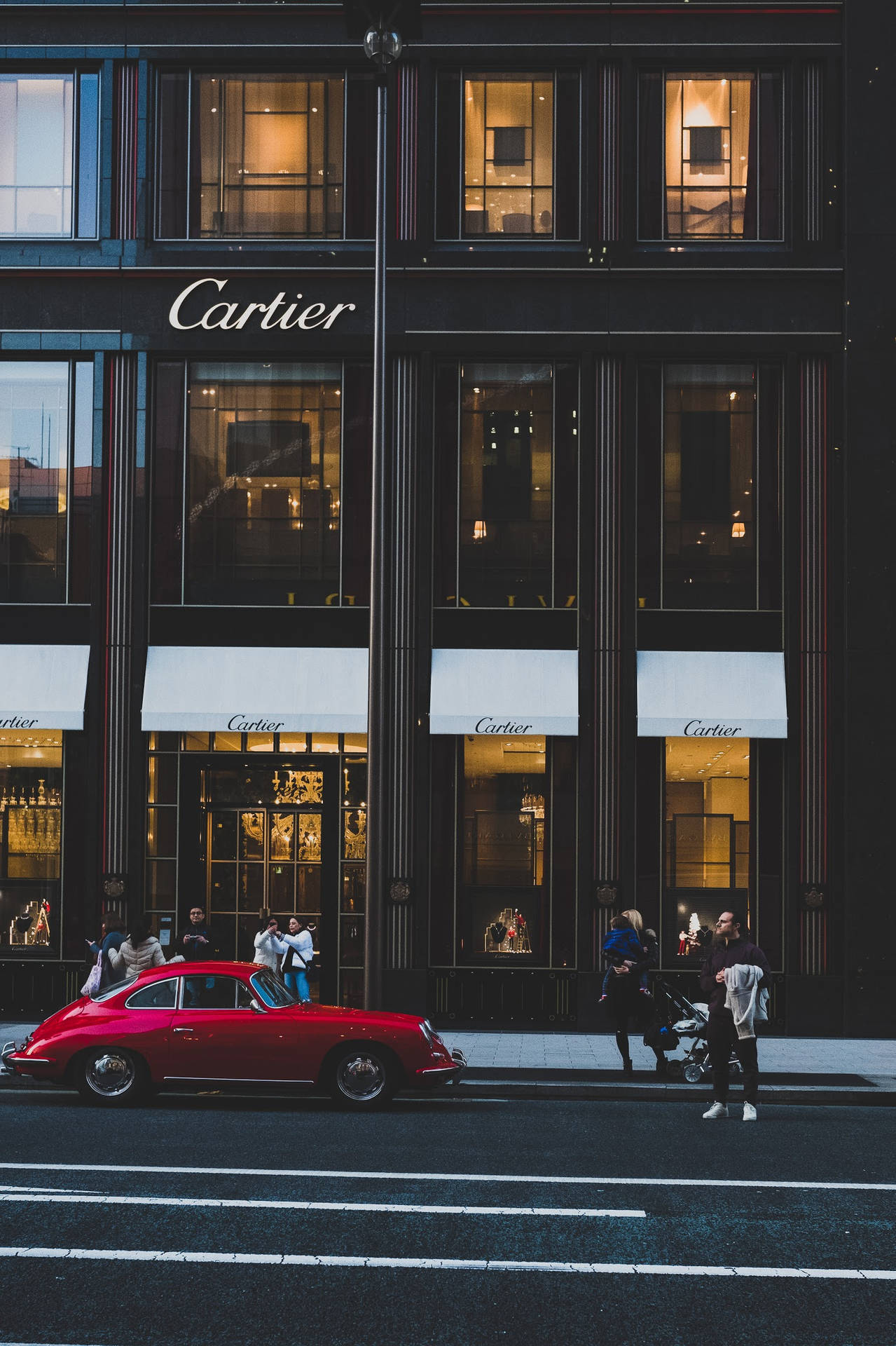 Red Luxury Car Outside Cartier Wallpaper