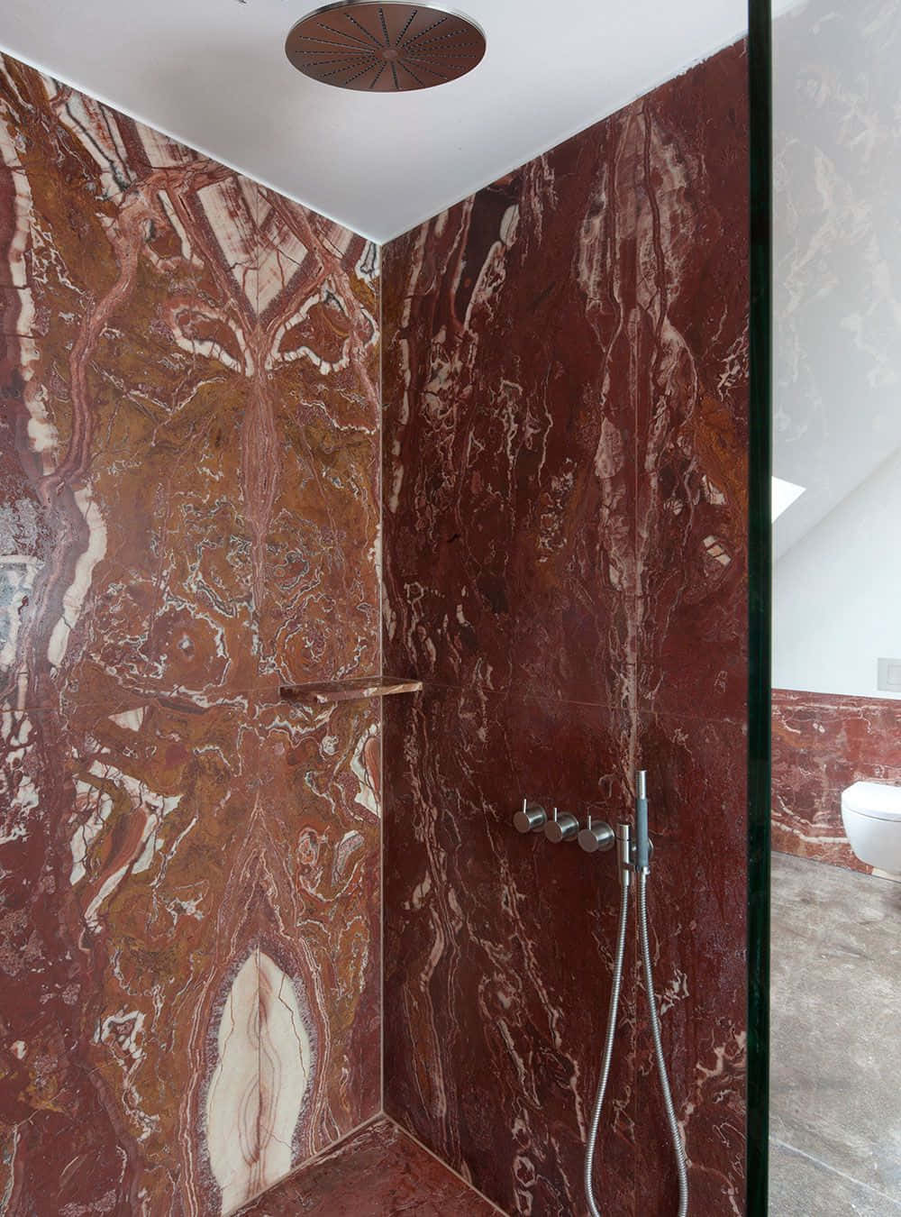 A Bathroom With A Marble Shower