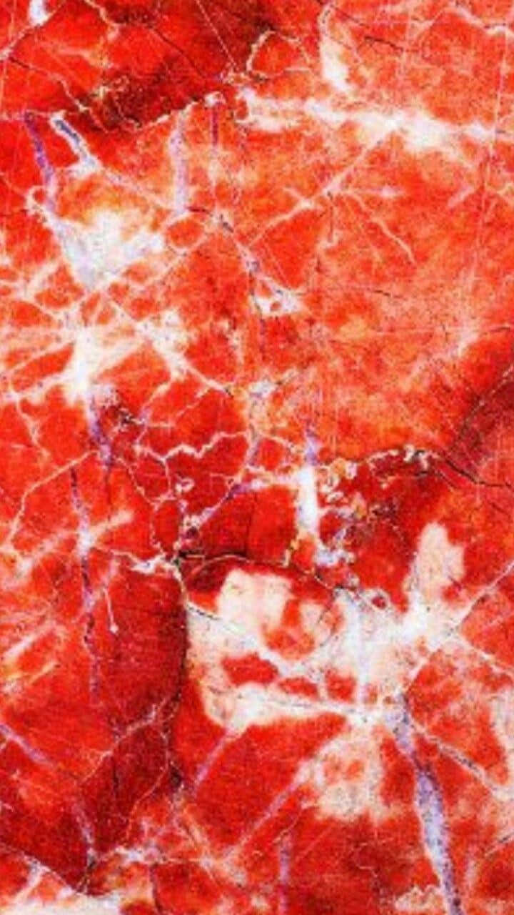 A Close Up Of A Red Marble Surface