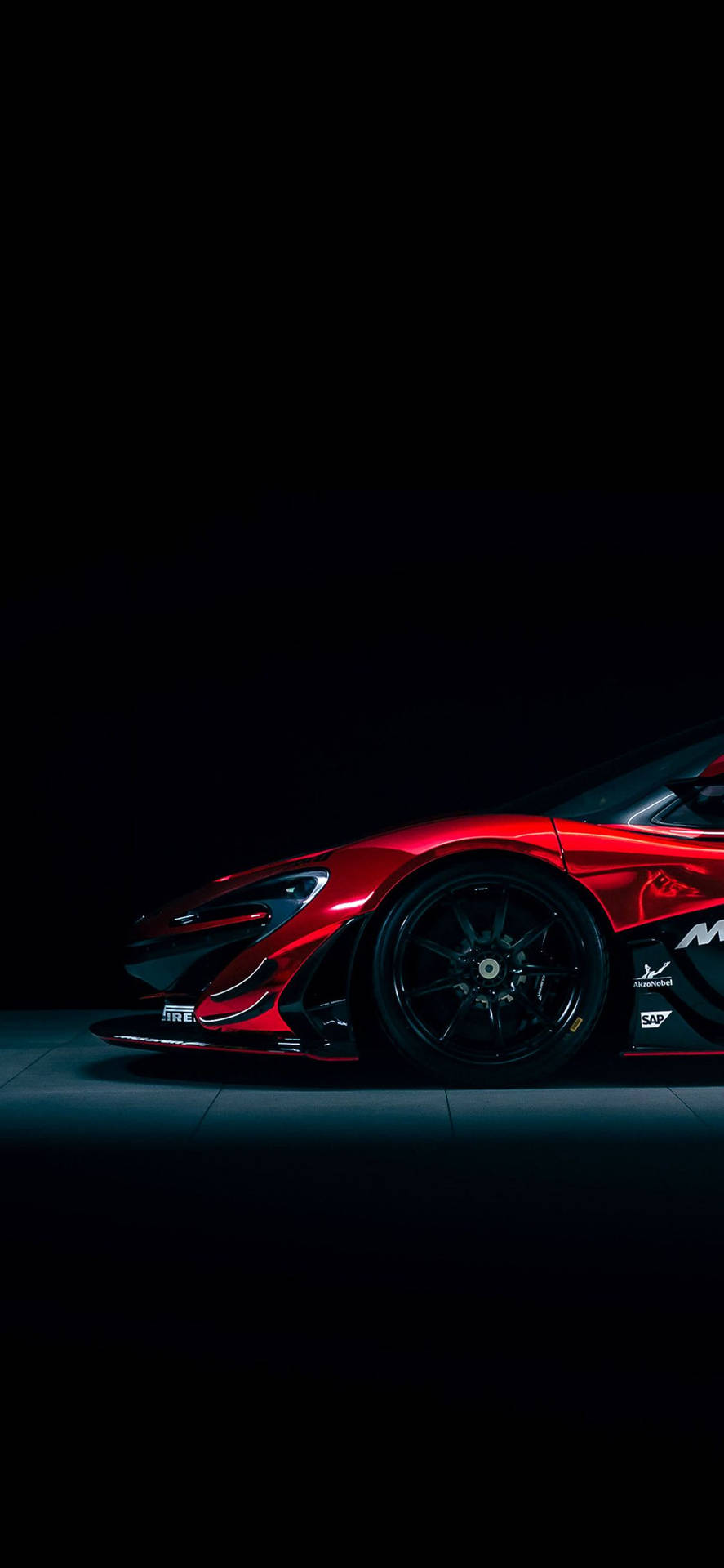 Majestic red McLaren P1 GTR parked on a racetrack. iPhone image for car enthusiasts. Wallpaper