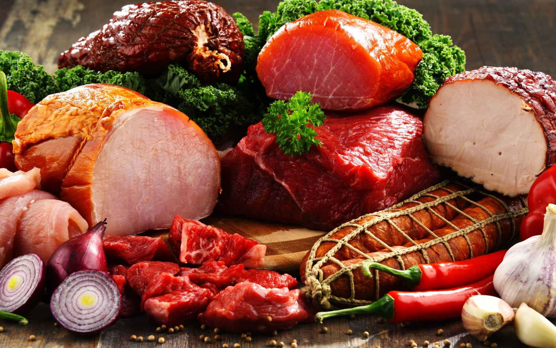 Juicy and Delicious Red Meat on a Wooden Board Wallpaper