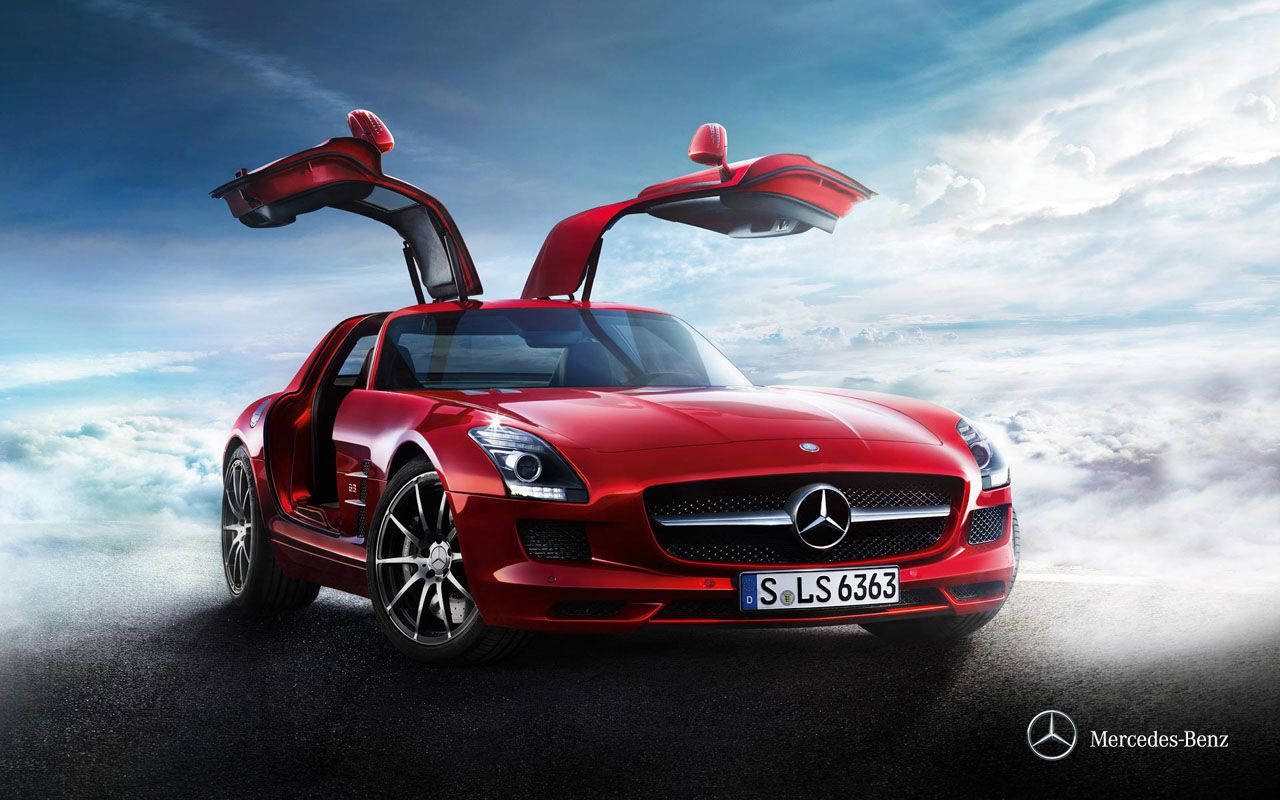 Red Mercedes-Benz SLS AMG car with gull-wing doors wallpaper.