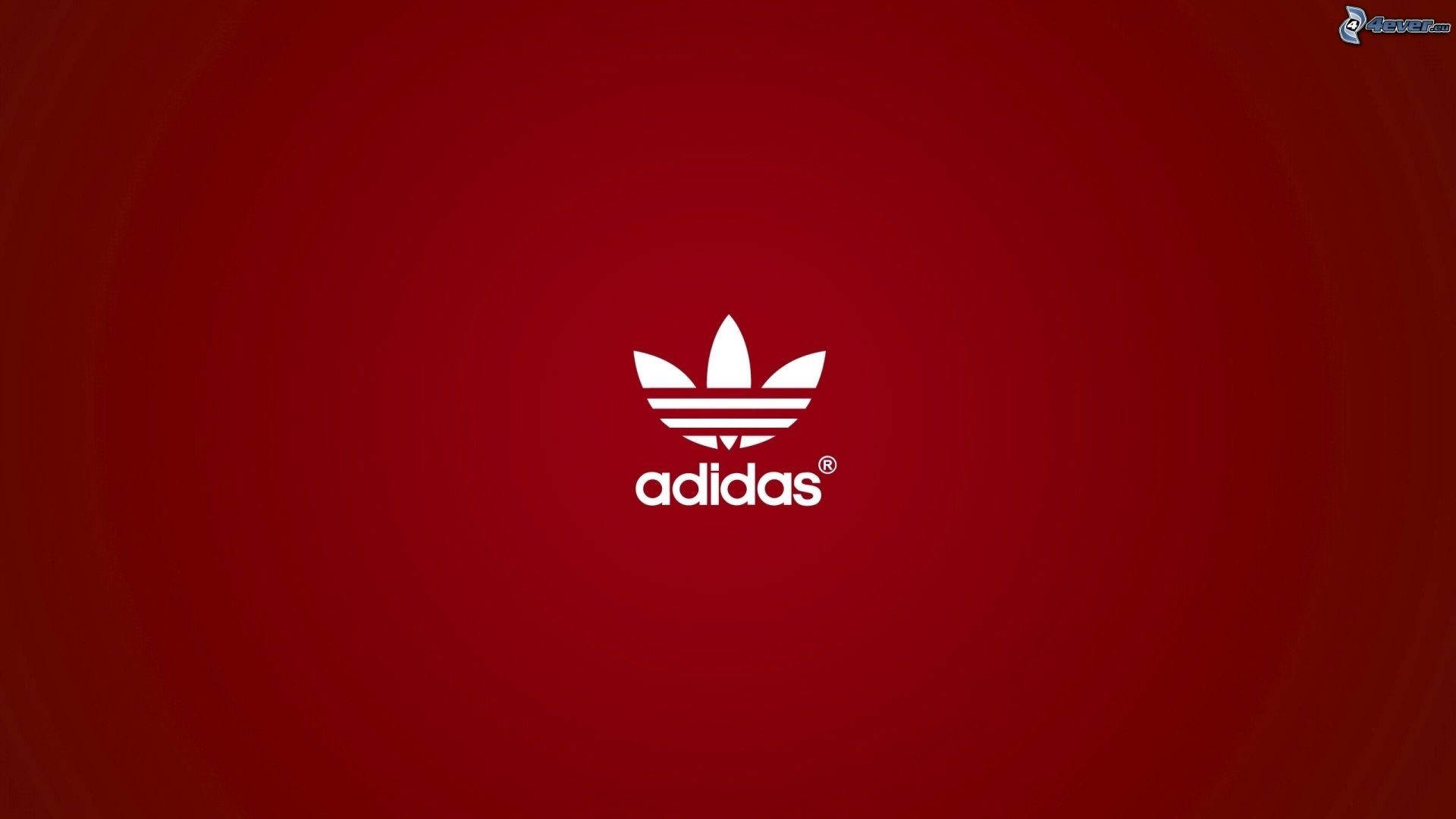 Show your bold style with the iconic Adidas red logo Wallpaper