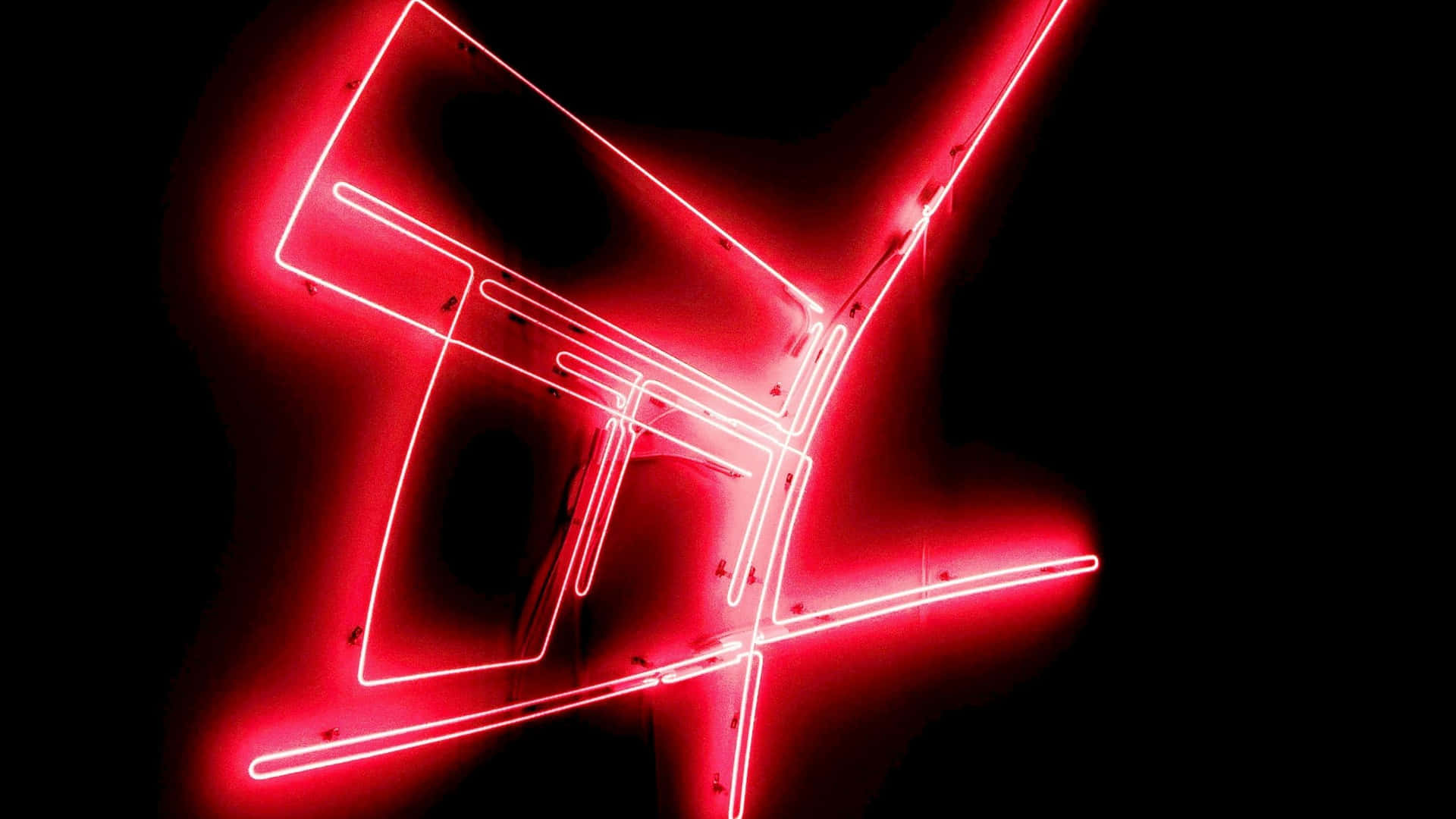 A Red Neon Sign With A Black Background