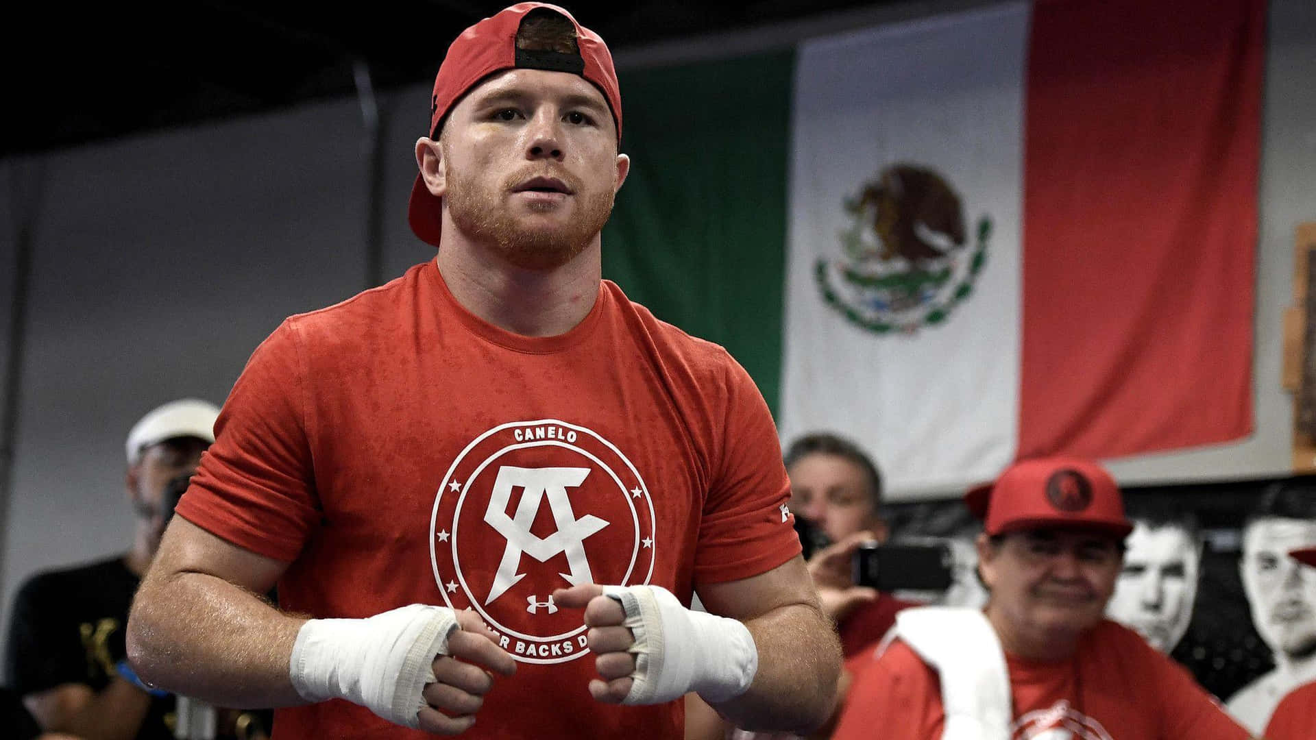 Boxing Champion Saul Canelo Alvarez In Red Outfit Wallpaper