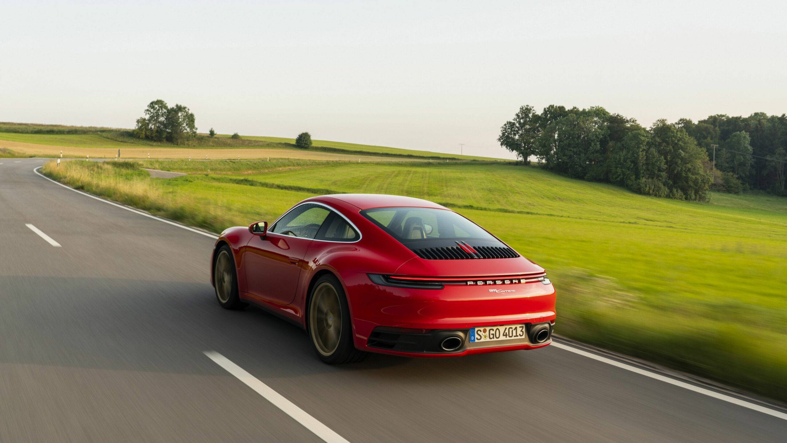 Red Porsche 911 In Countryside Background