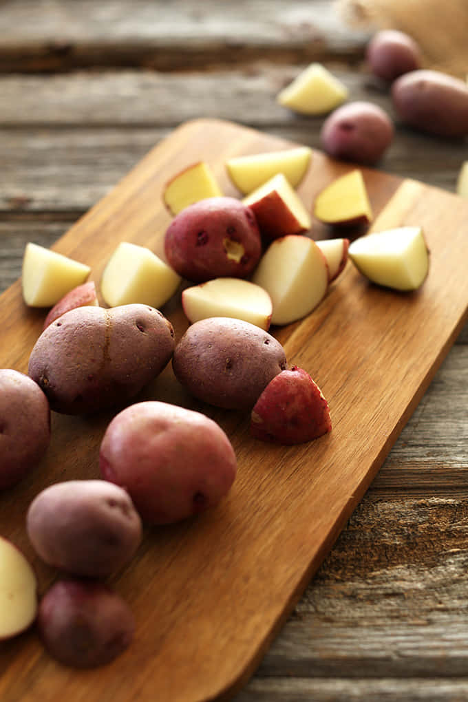 A pile of fresh and vibrant red potatoes Wallpaper