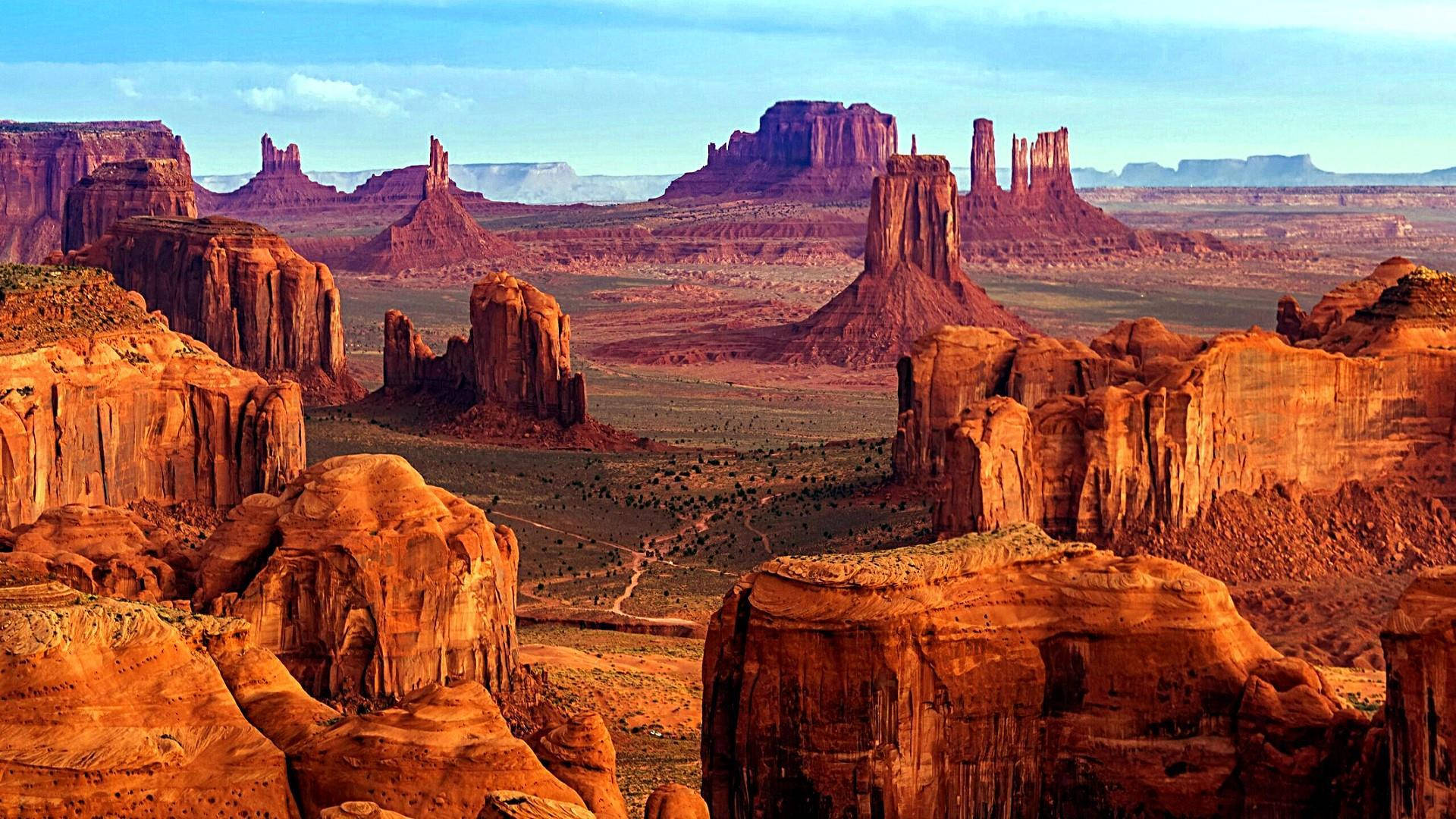 Formazionidi Rocce Rosse A Monument Valley Sfondo
