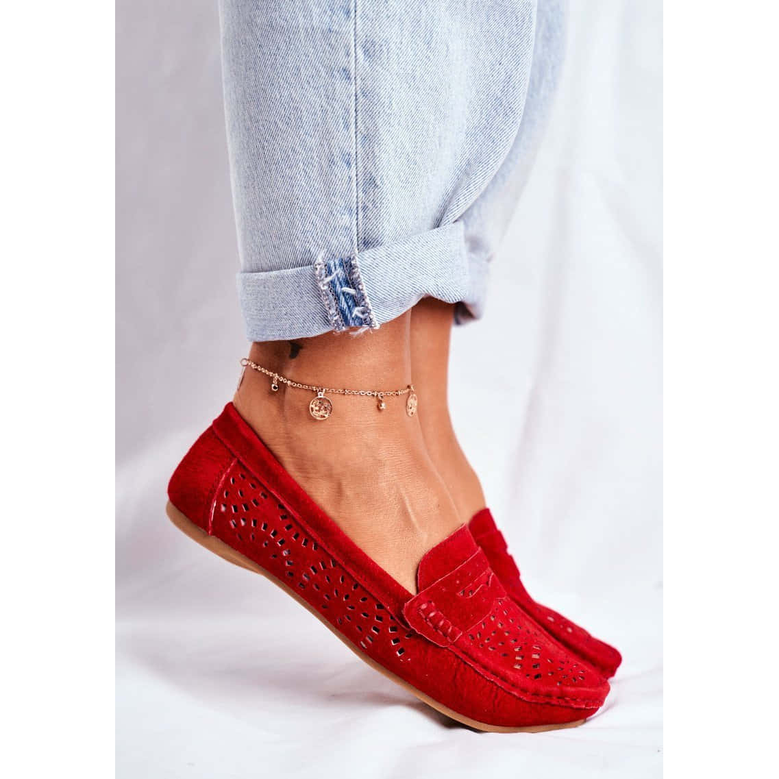 Trendy Red Shoes on a Wooden Floor Wallpaper