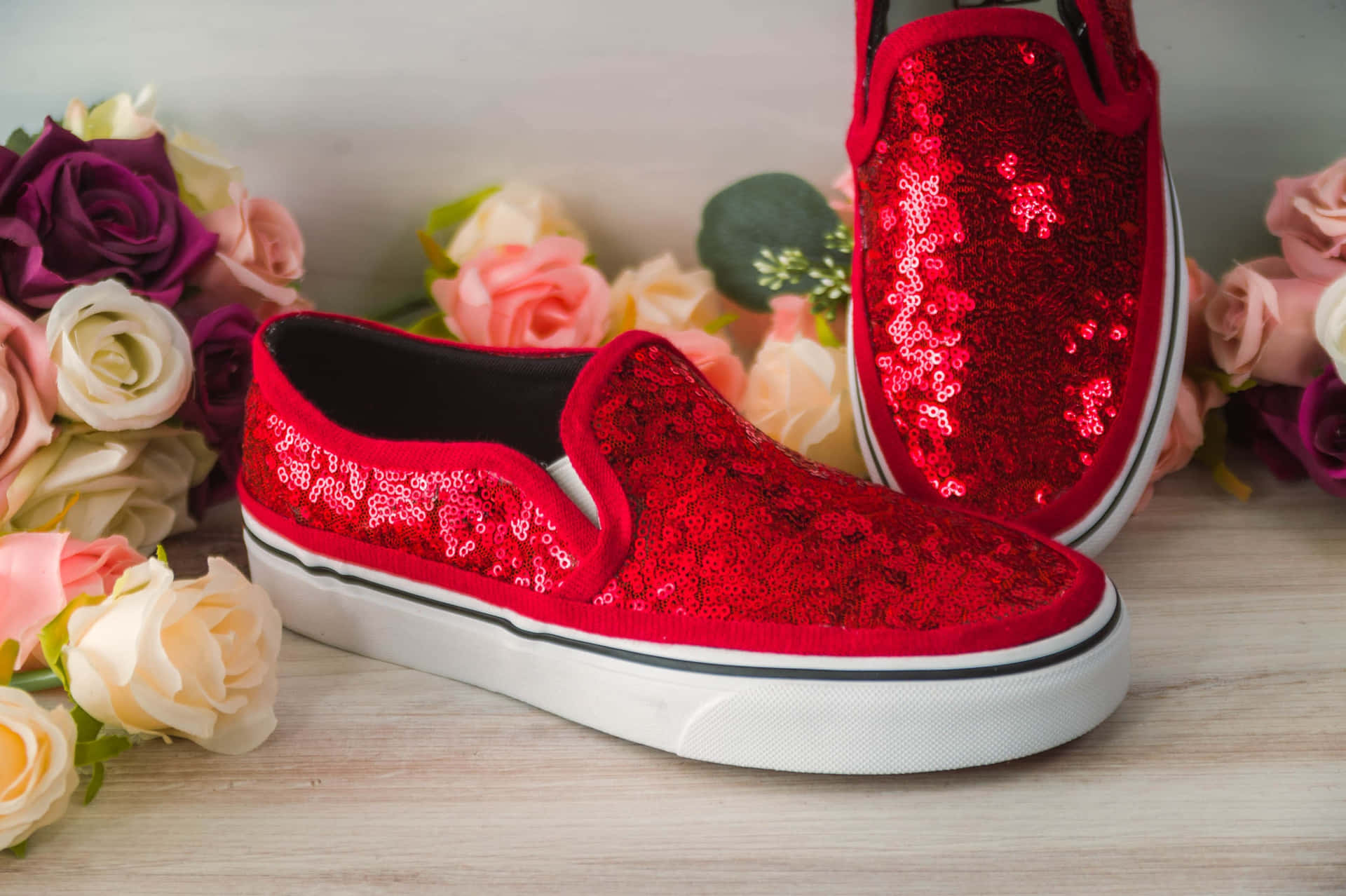 Stylish Red Shoes on a Wooden Surface Wallpaper