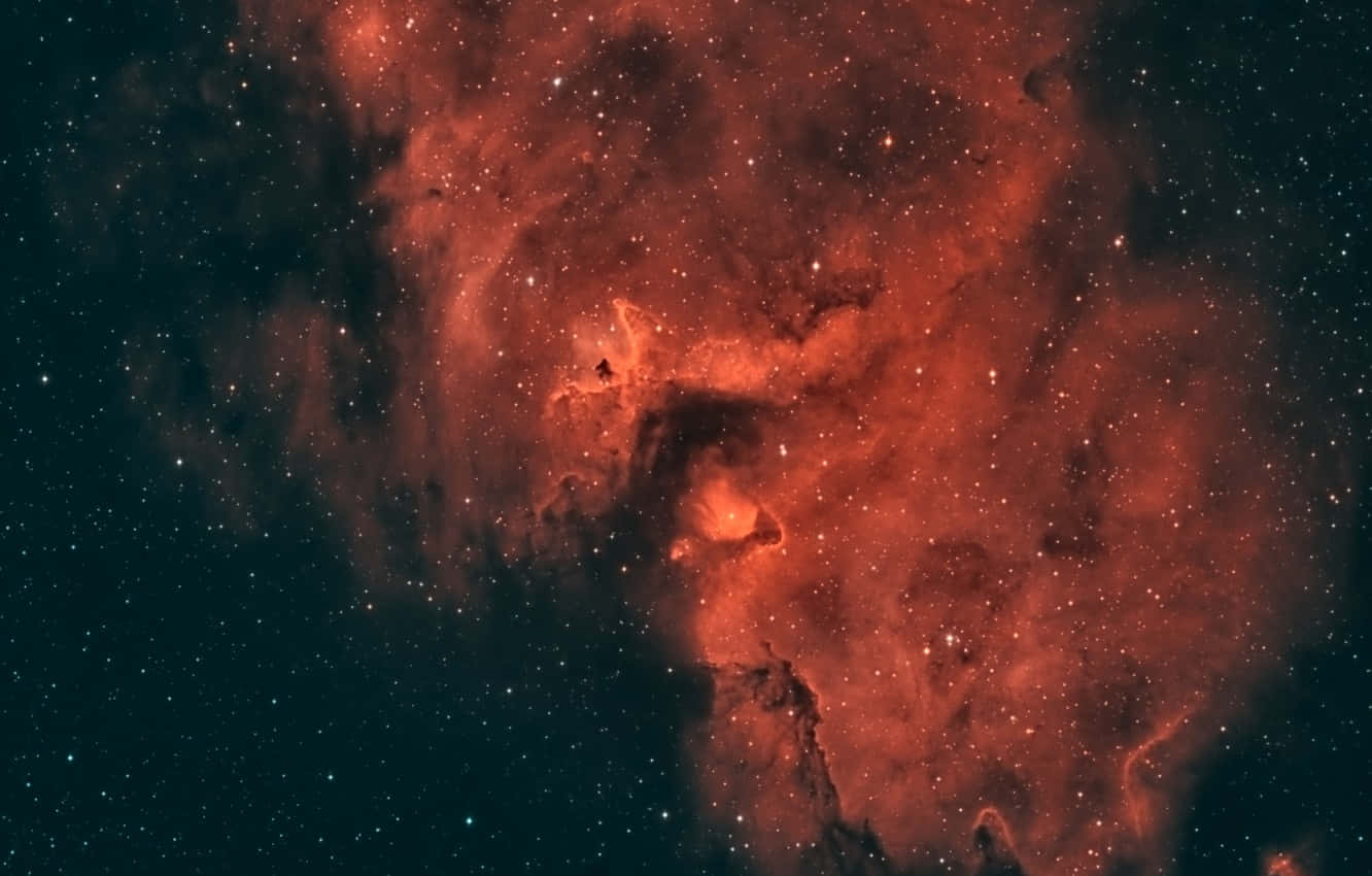 En rød nebula i rummet Wallpaper