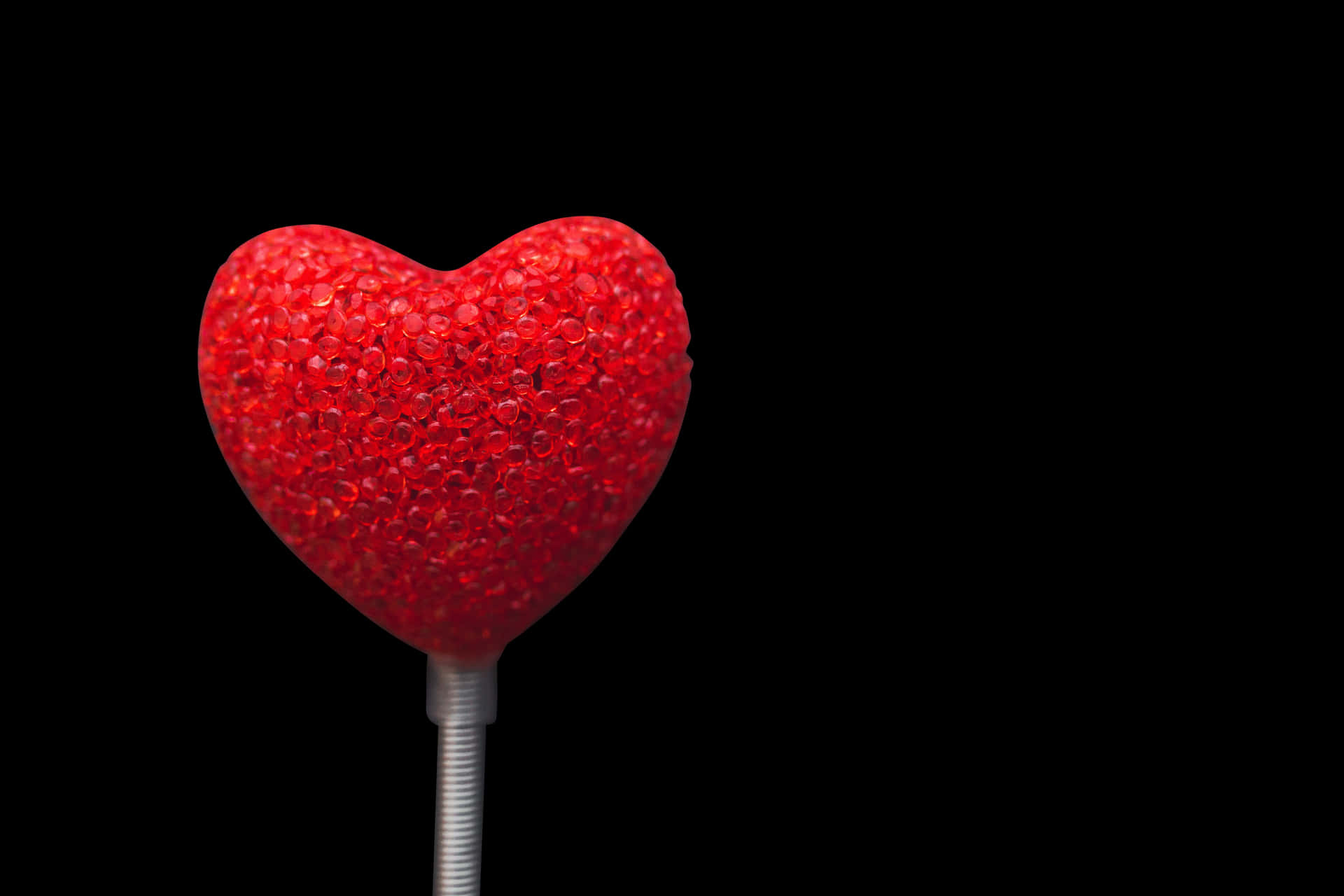 Red Sparkling Hearton Black Background PNG