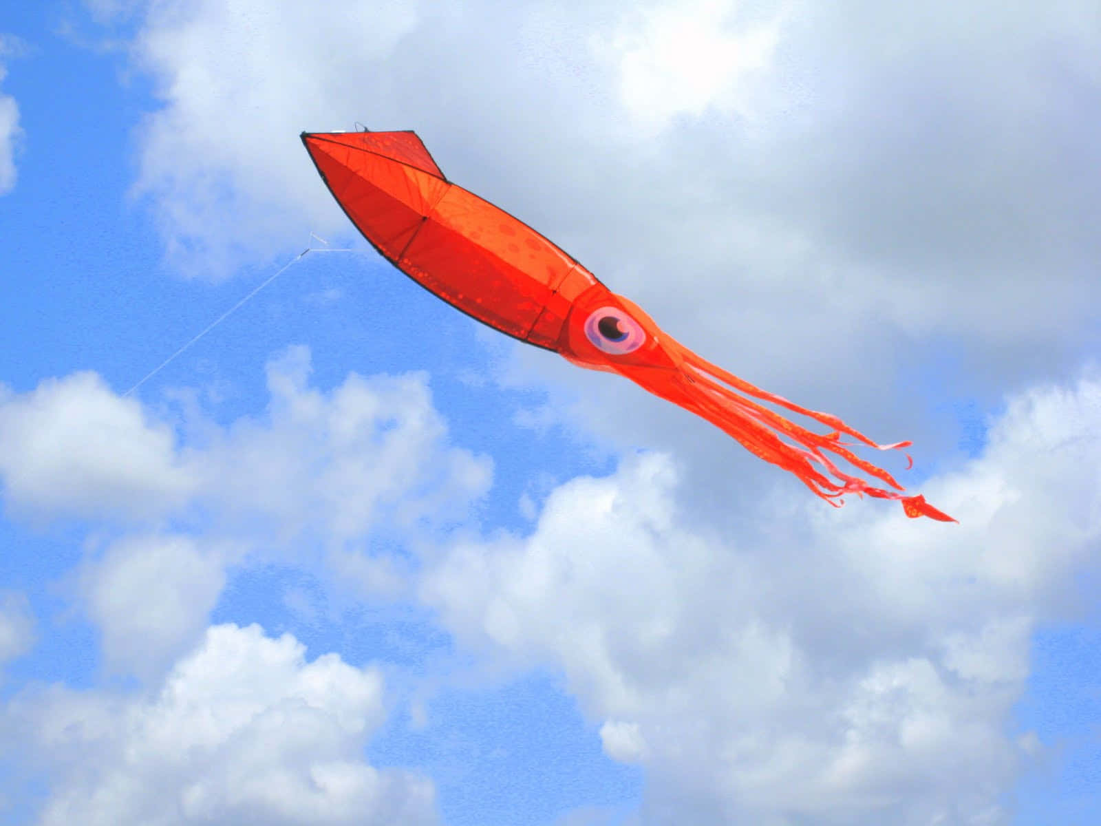 Red Squid Kite Against Blue Sky Wallpaper