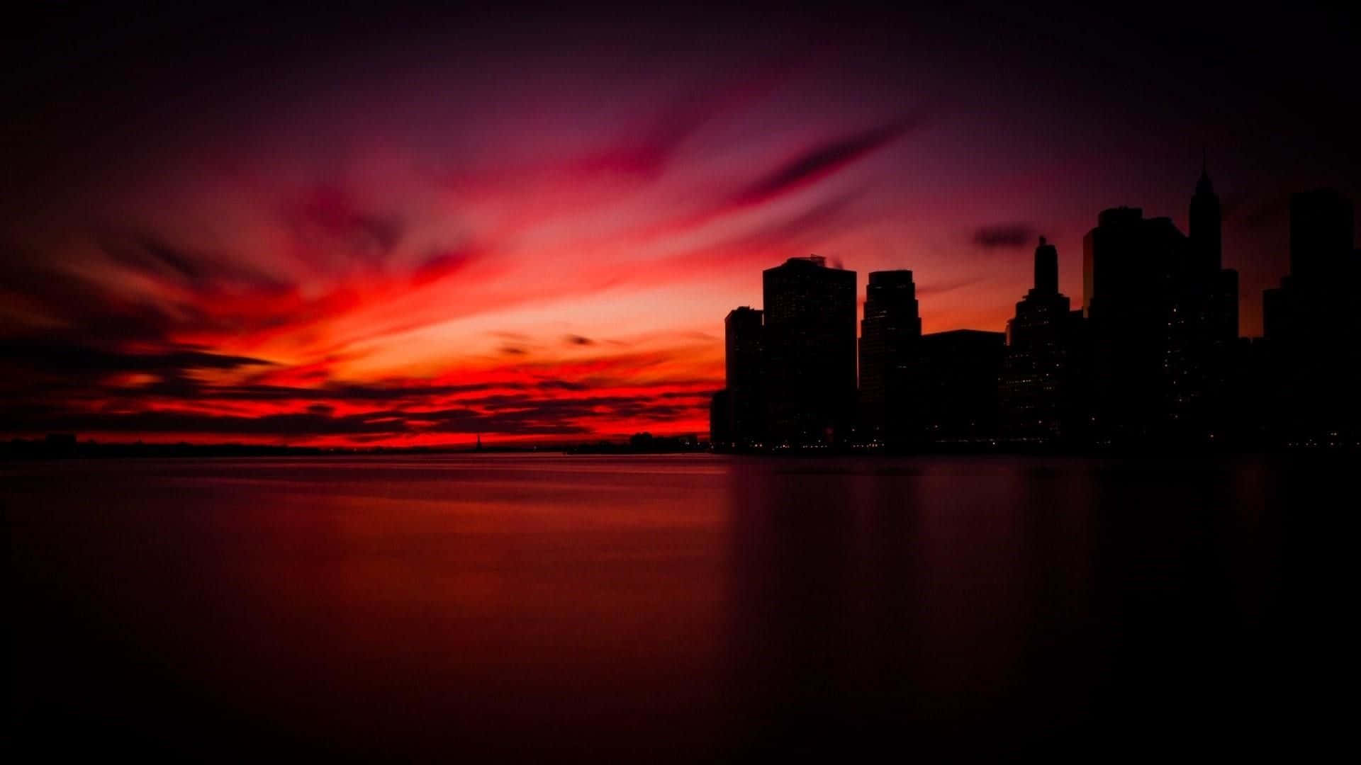 Stunning Red Sunset Over the Horizon Wallpaper