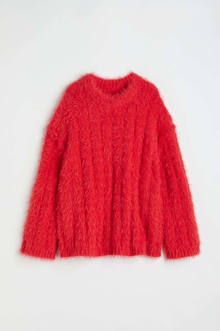 Chicaen Un Elegante Suéter Rojo Fondo de pantalla