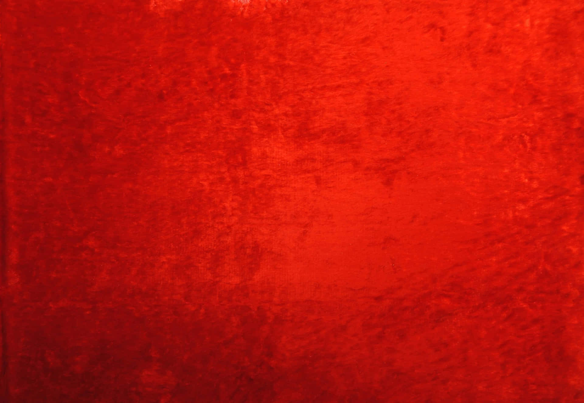 A vibrant and textured red background