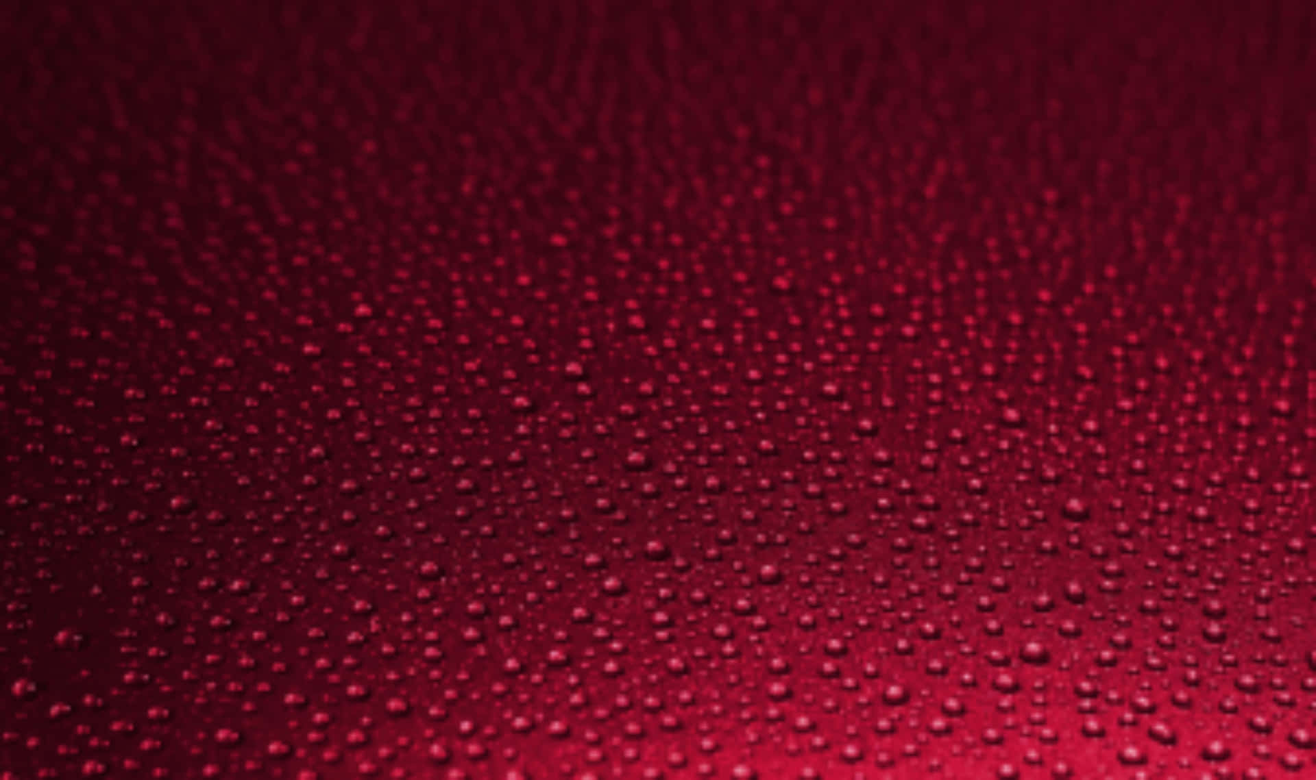 Immaginedi Sfondo Rossa Con Texture A Gocce D'acqua Rosse.