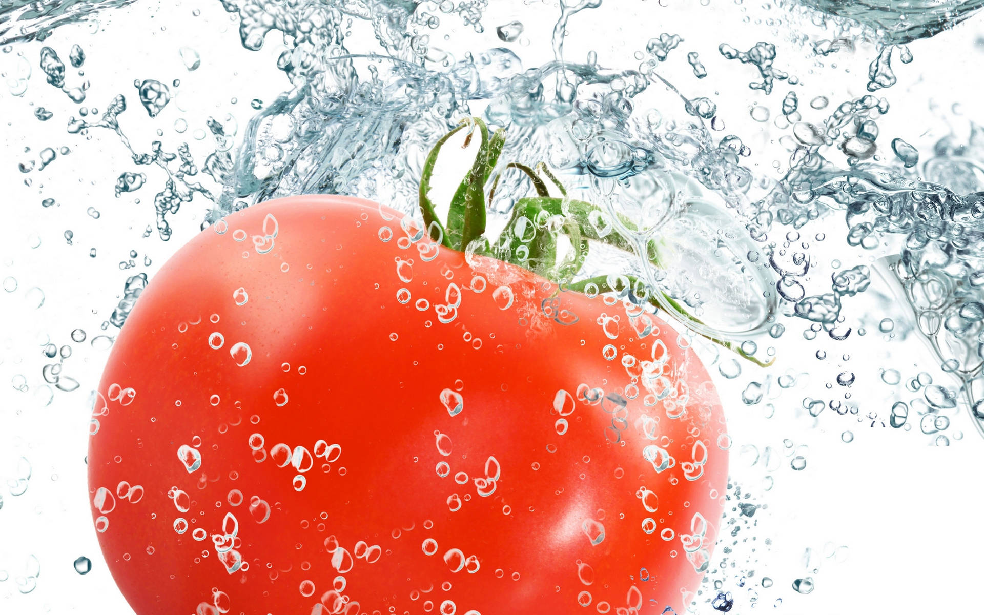 Red Tomato Fruit In A Splashing Action Wallpaper