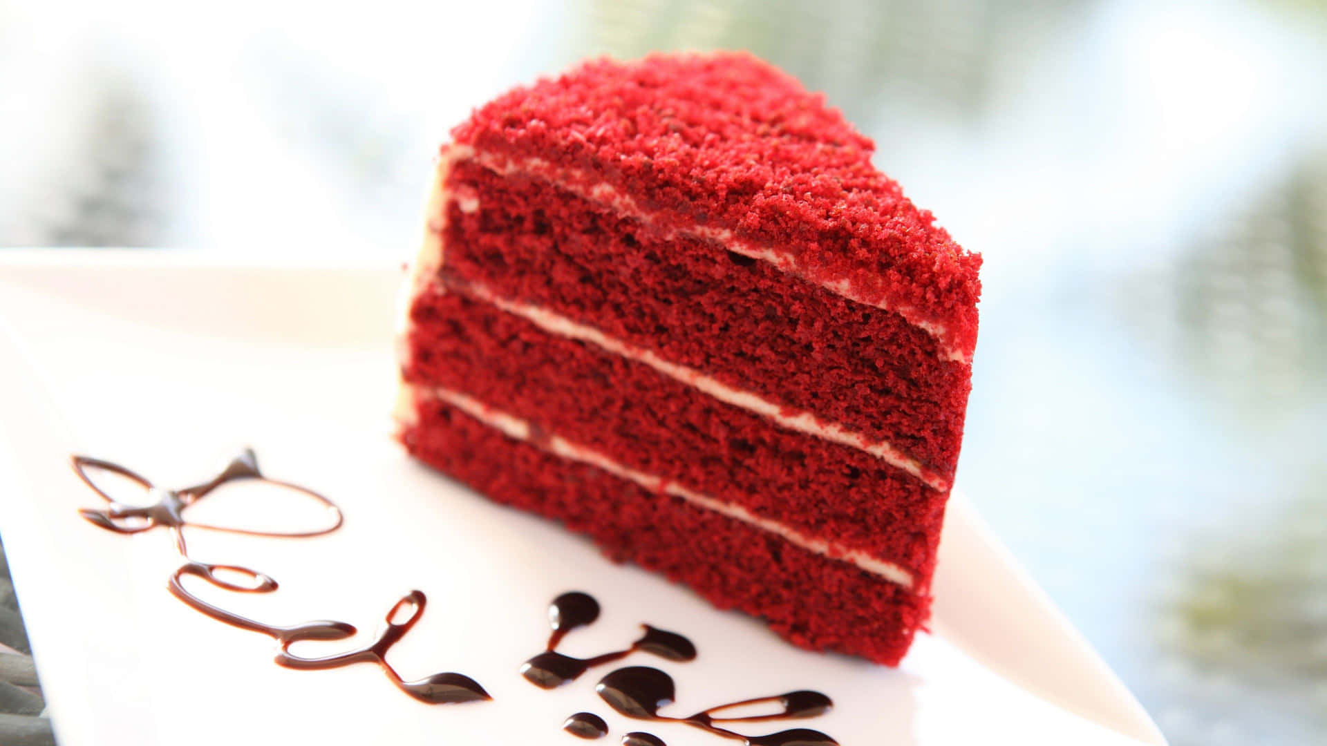 Scrumptious Red Velvet Cake on a Plate Wallpaper