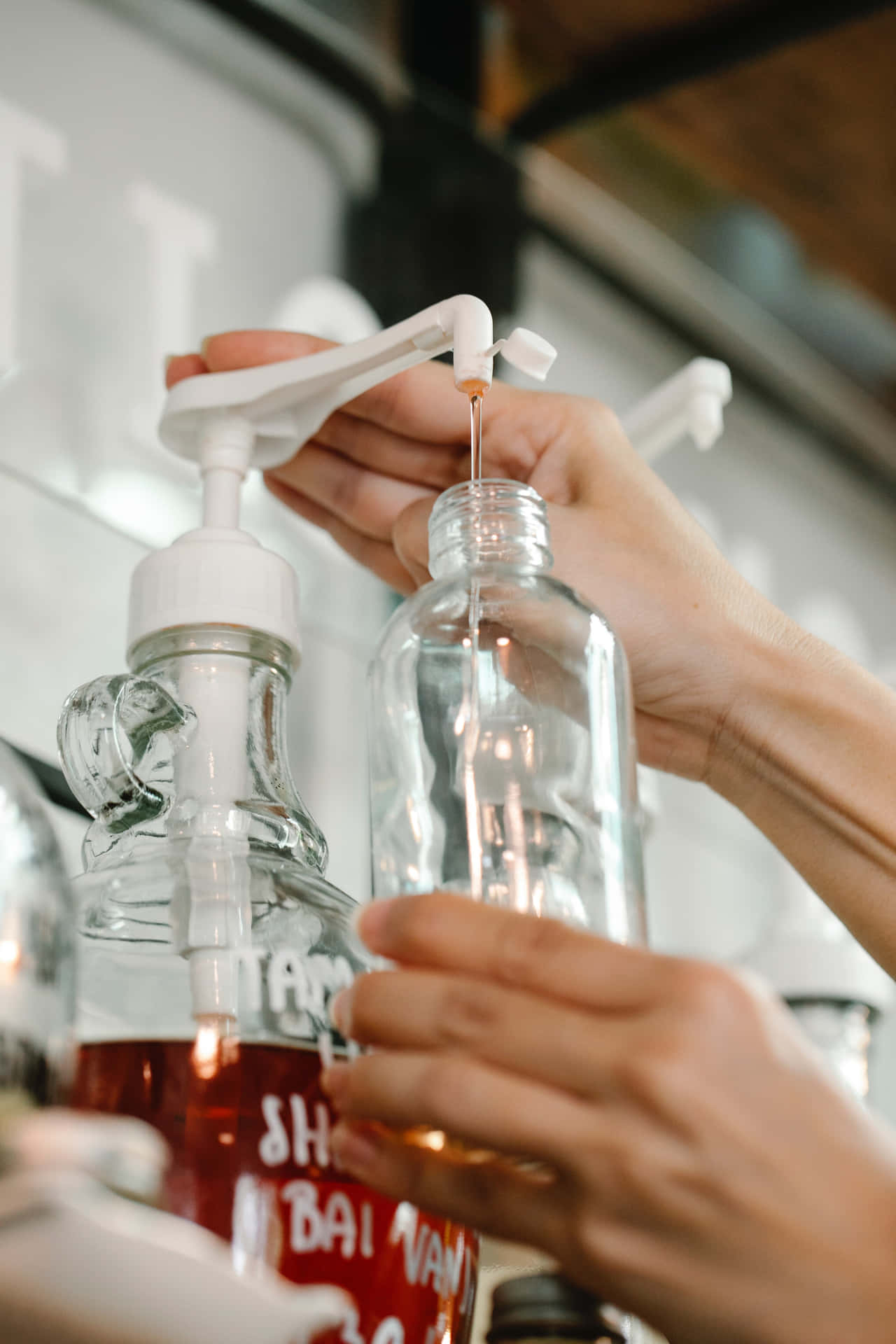 Refilling Antiseptic Liquid Wash Bottle Wallpaper